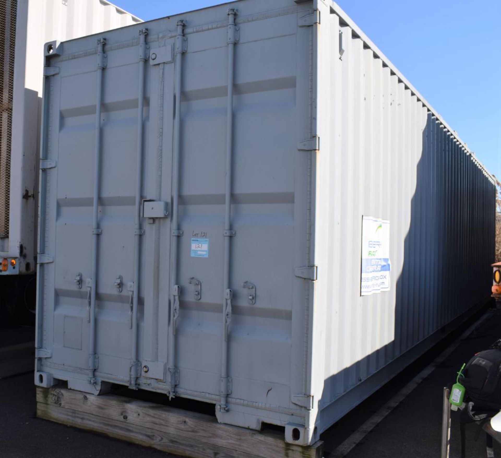 40' Shipping Container With Contents. With cantilever storage racks, metal shelves, oil drum, metal