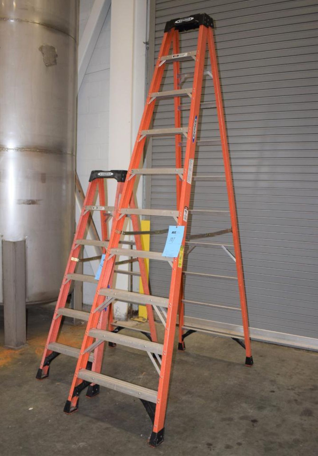 Lot Of (2) Werner Fiberglass Step Ladders. 1-10' tall, 1-6' tall.