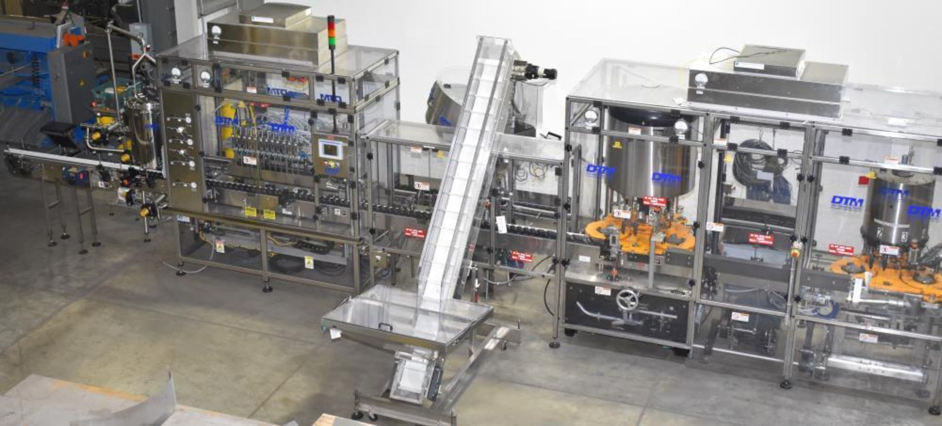 Used- DTM Purefill 2000 Liquid Filling Line with Garvey Feed Table. Pneumatic Scale Model PSC8 plugg - Image 4 of 88