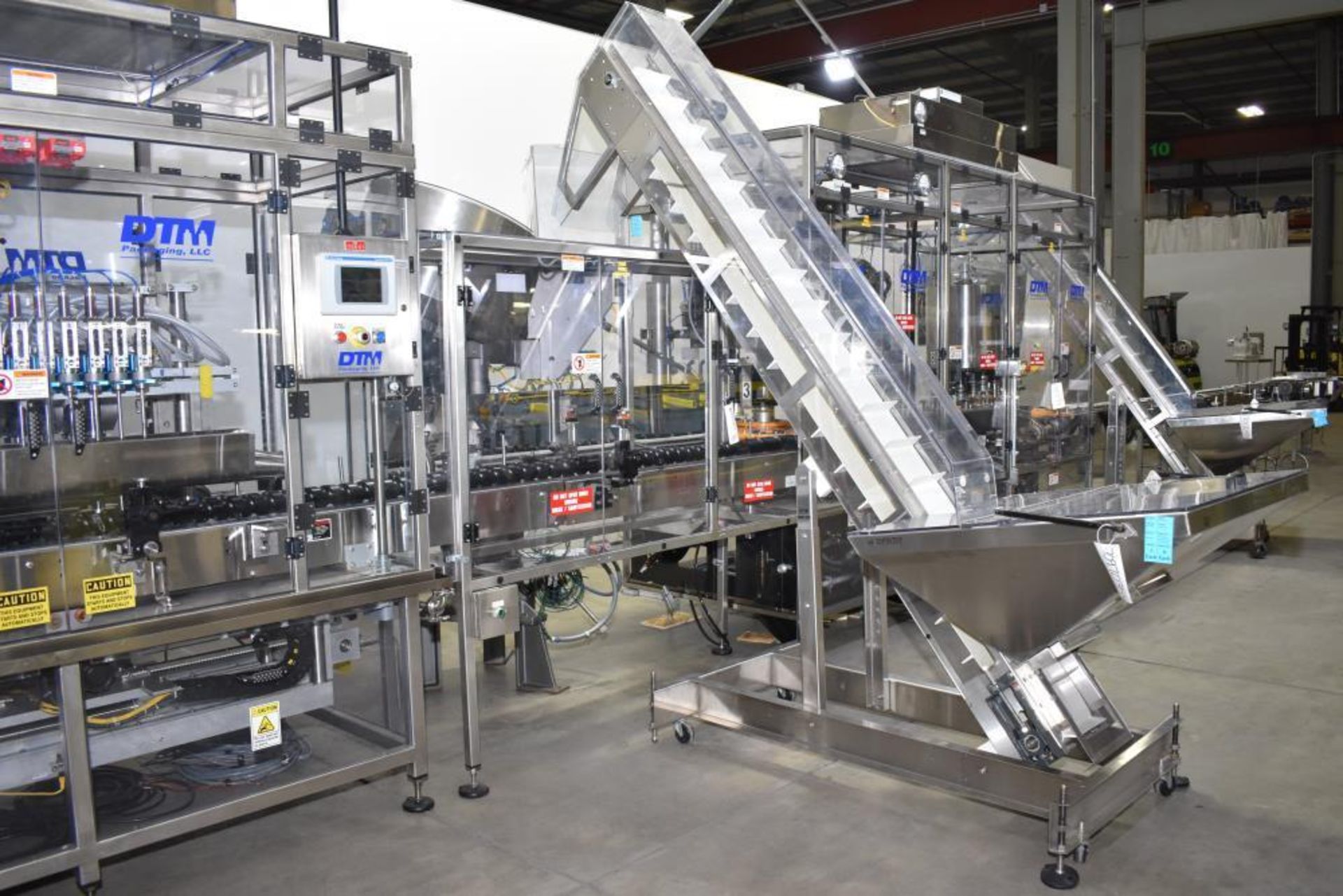 Used- DTM Purefill 2000 Liquid Filling Line with Garvey Feed Table. Pneumatic Scale Model PSC8 plugg - Image 30 of 88