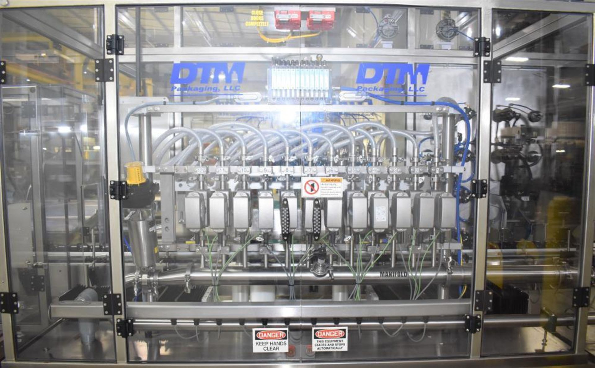 Used- DTM Purefill 2000 Liquid Filling Line with Garvey Feed Table. Pneumatic Scale Model PSC8 plugg - Image 20 of 88