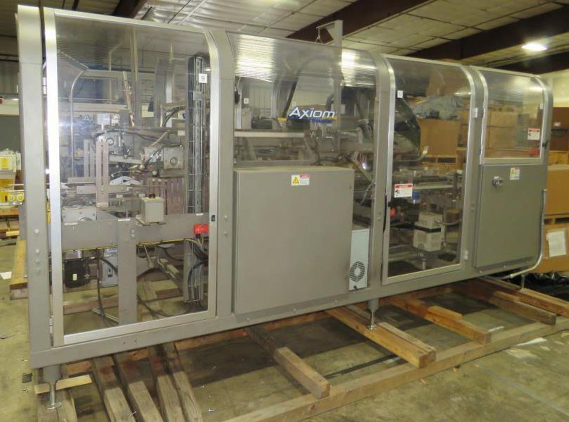 Used- Douglas Machine Axiom Wraparound Case/Tray Packer. Capable of Speeds up to 50 cases per minute