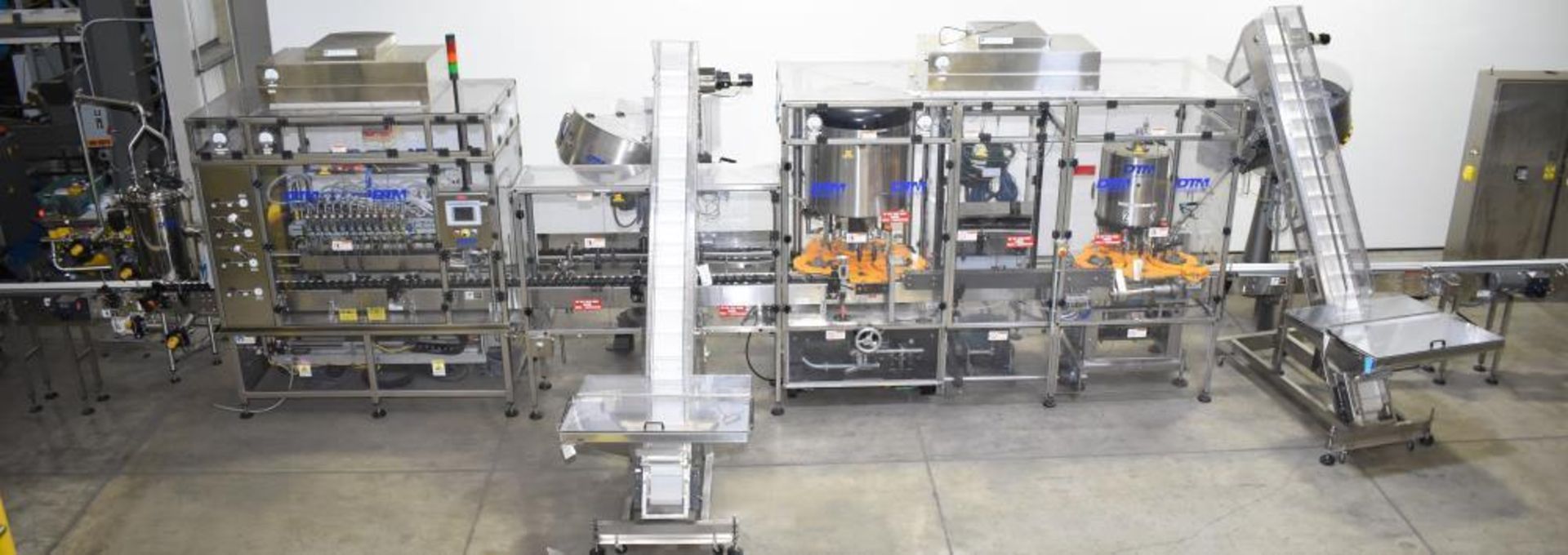 Used- DTM Purefill 2000 Liquid Filling Line with Garvey Feed Table. Pneumatic Scale Model PSC8 plugg - Image 3 of 88