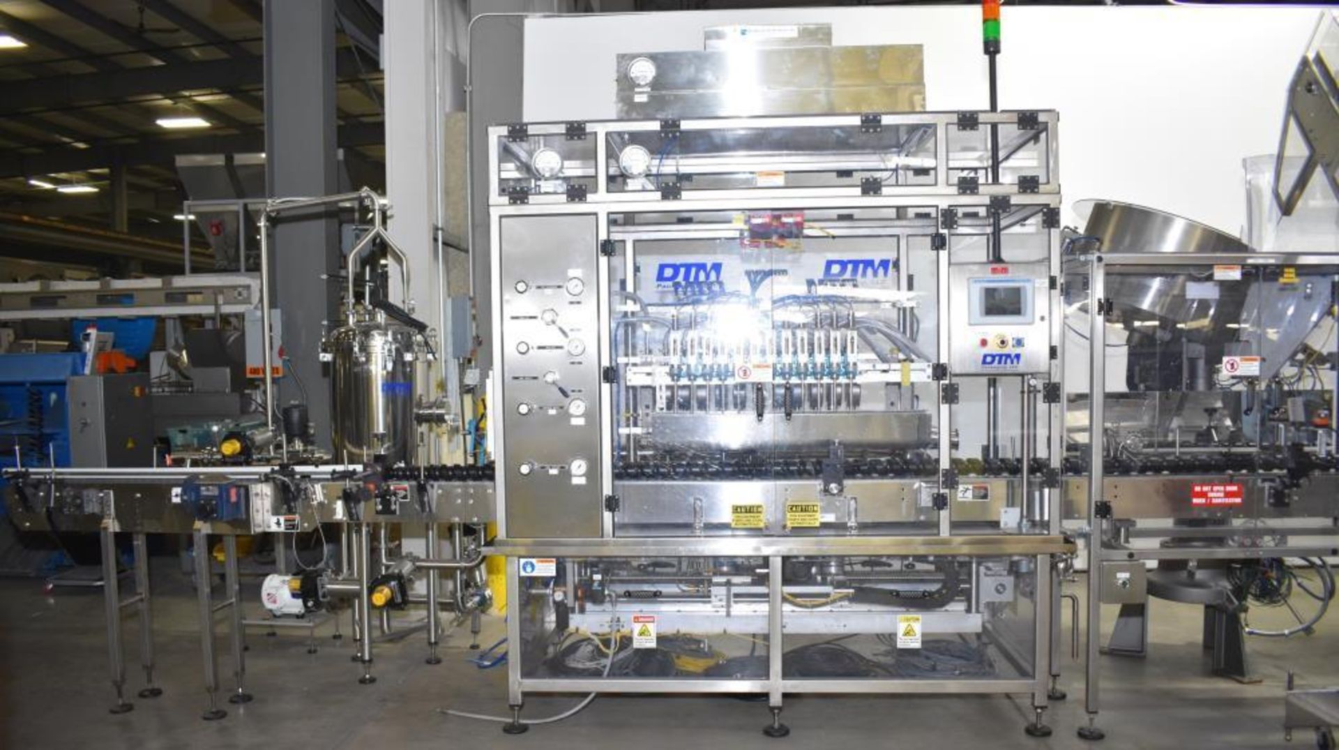 Used- DTM Purefill 2000 Liquid Filling Line with Garvey Feed Table. Pneumatic Scale Model PSC8 plugg - Image 14 of 88