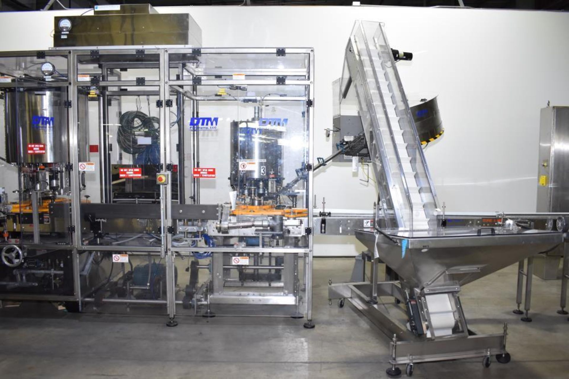 Used- DTM Purefill 2000 Liquid Filling Line with Garvey Feed Table. Pneumatic Scale Model PSC8 plugg - Image 60 of 88