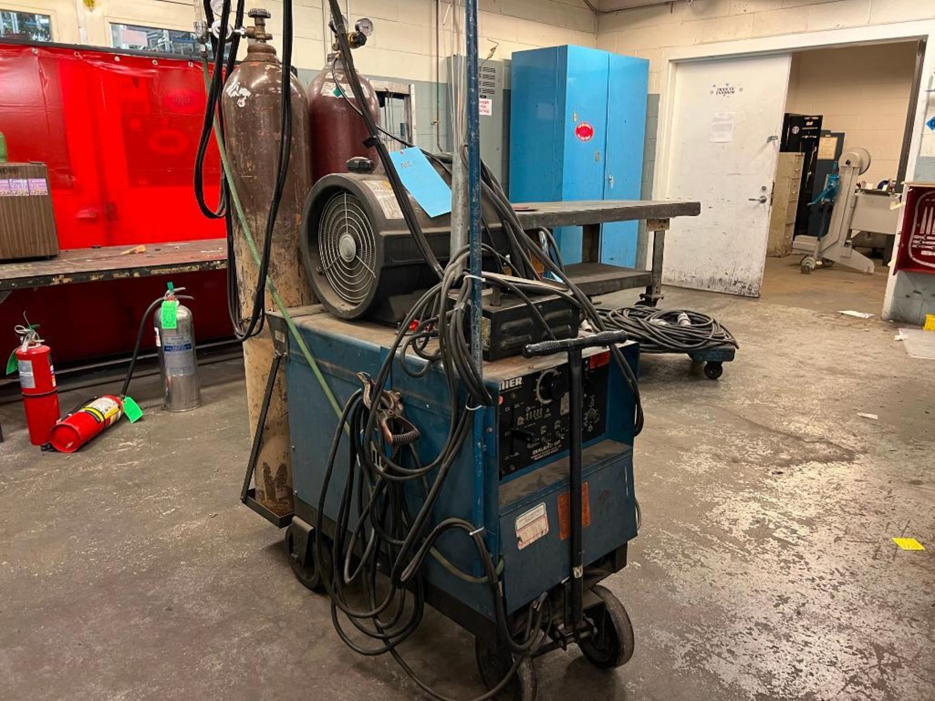 Miller AC/DC Arc Welder Model Dialarc HF, S/N JF923178, with Miller Coolmate 4, (2) Tanks, all on (1