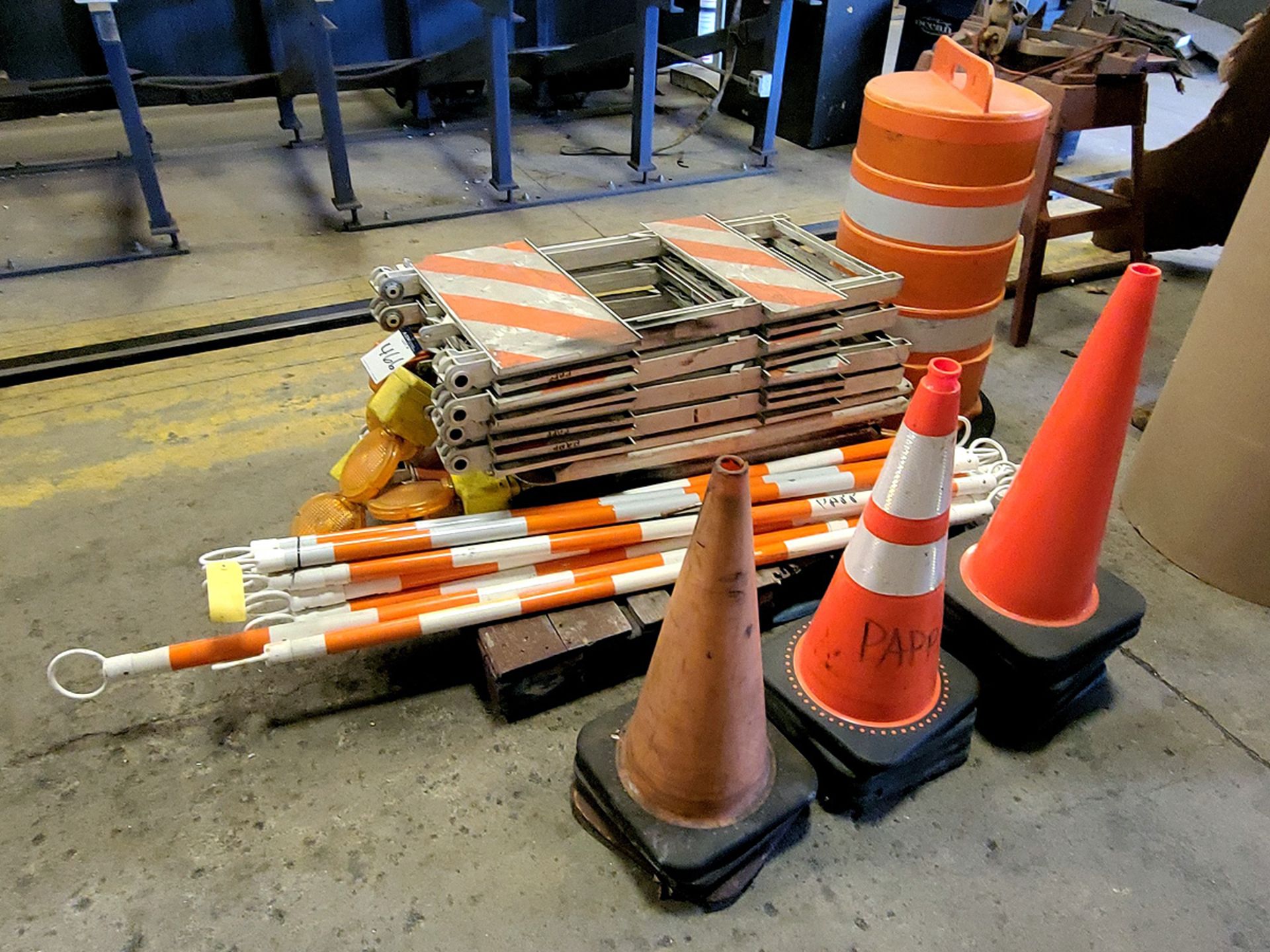 A Group of Safety Barriers Stands, Cones and Poles