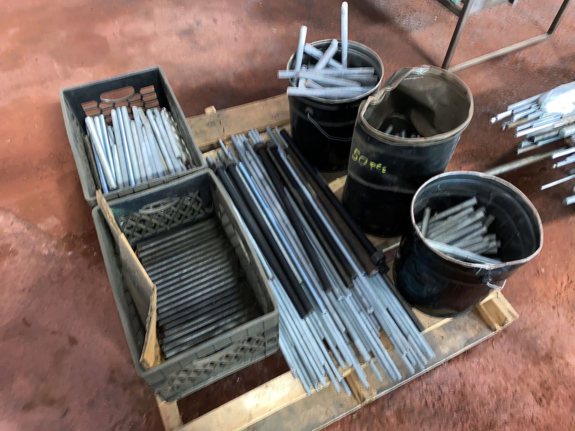 A Group of Threaded Rod On Pallet