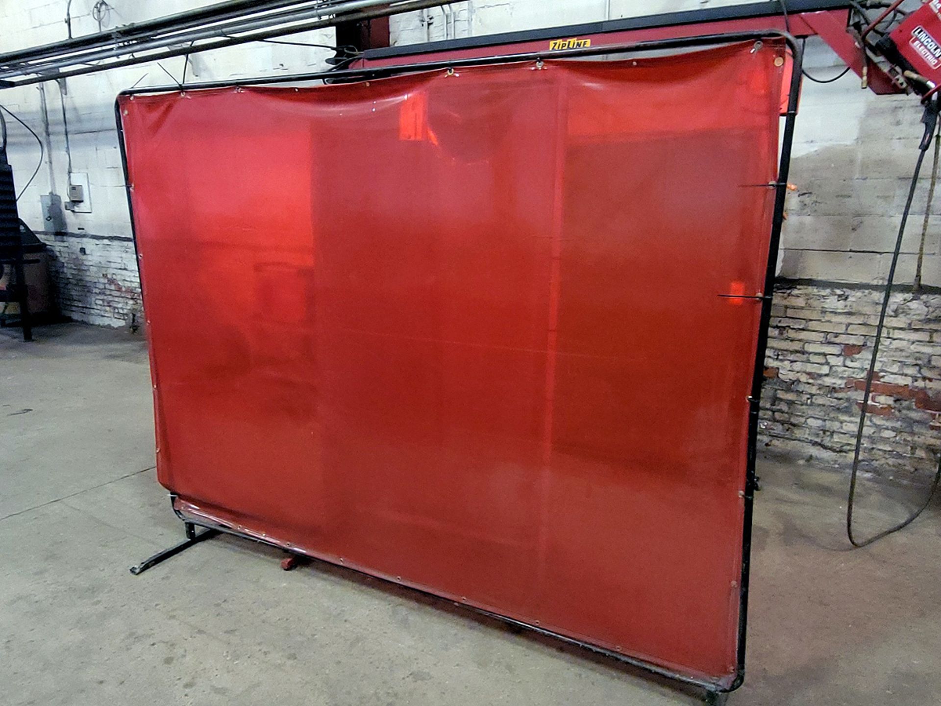 A Group of 6' x 6' Welding Screens Mounted on Metal Frames