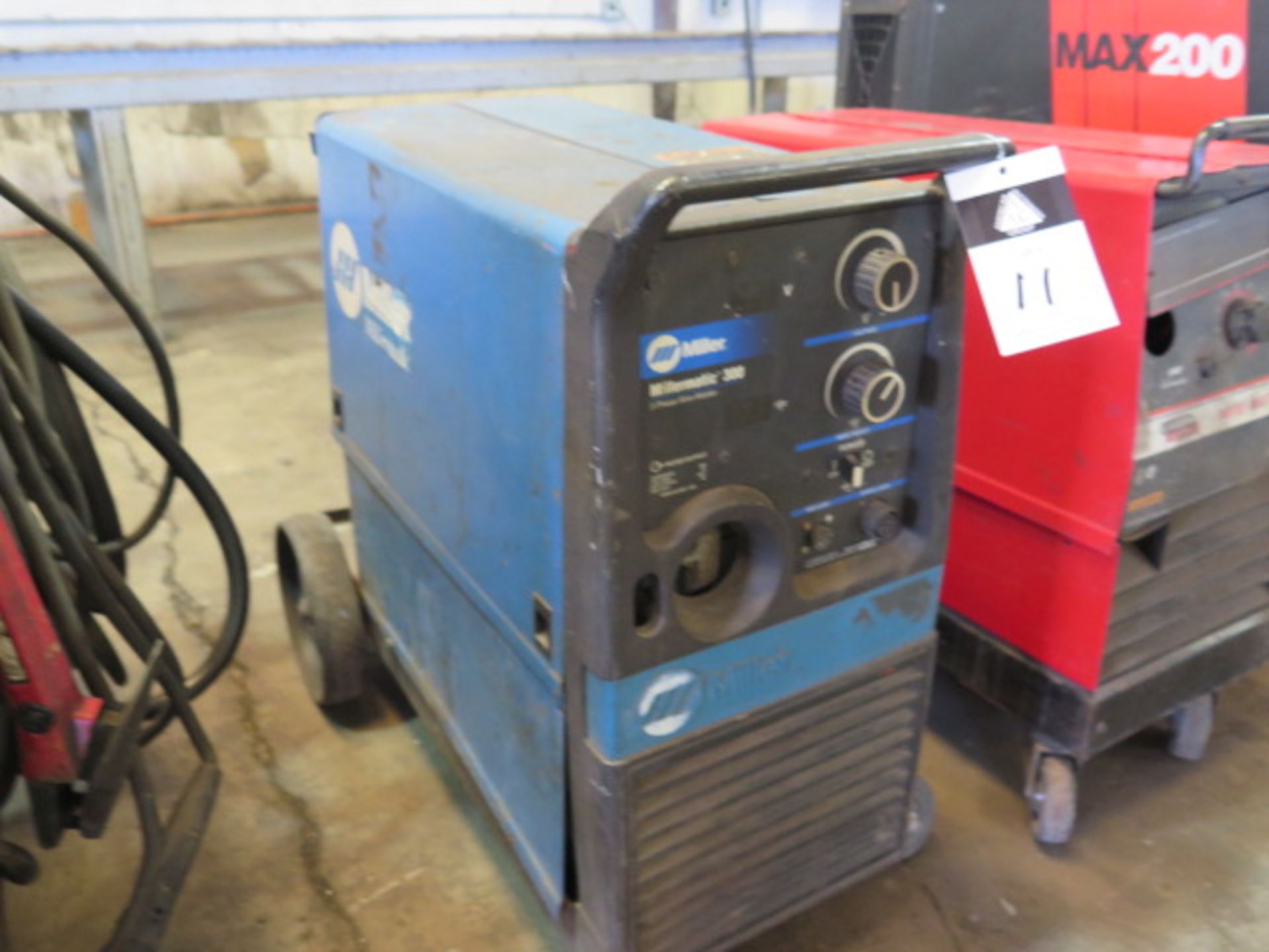 Miller Millermatic 300 Arc Welding Power Source / Wire Feeder (HAS BROKEN FRONT WHEELS) (SOLD AS-