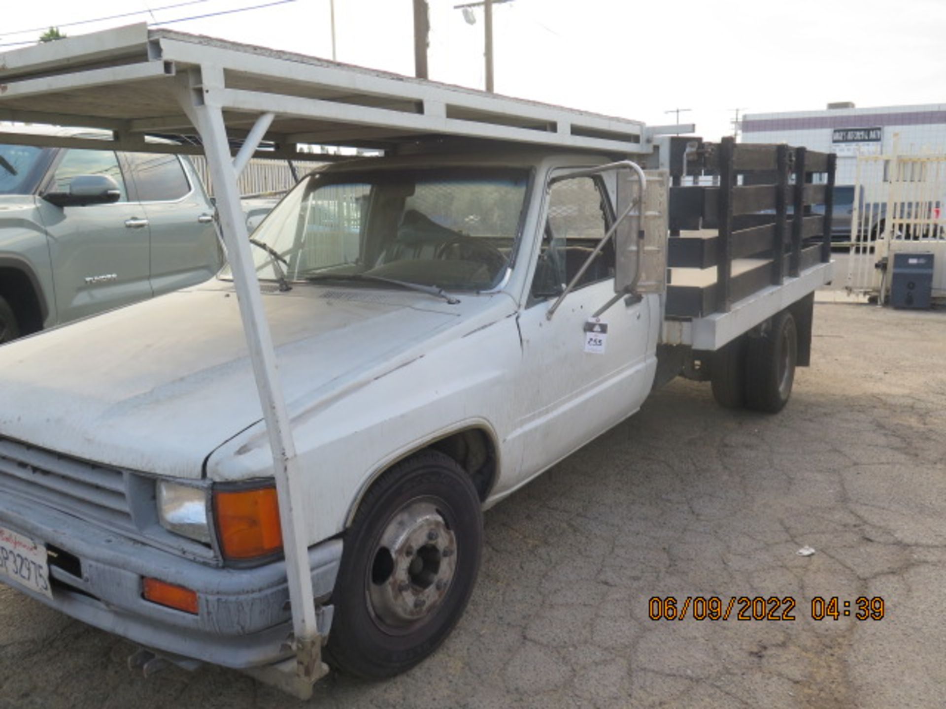 1987 Toyota 9' Stake Bed Truck Lisc# 6P32975 w/ Gas Engine, 5-Speed Manual Trans, SOLD AS IS