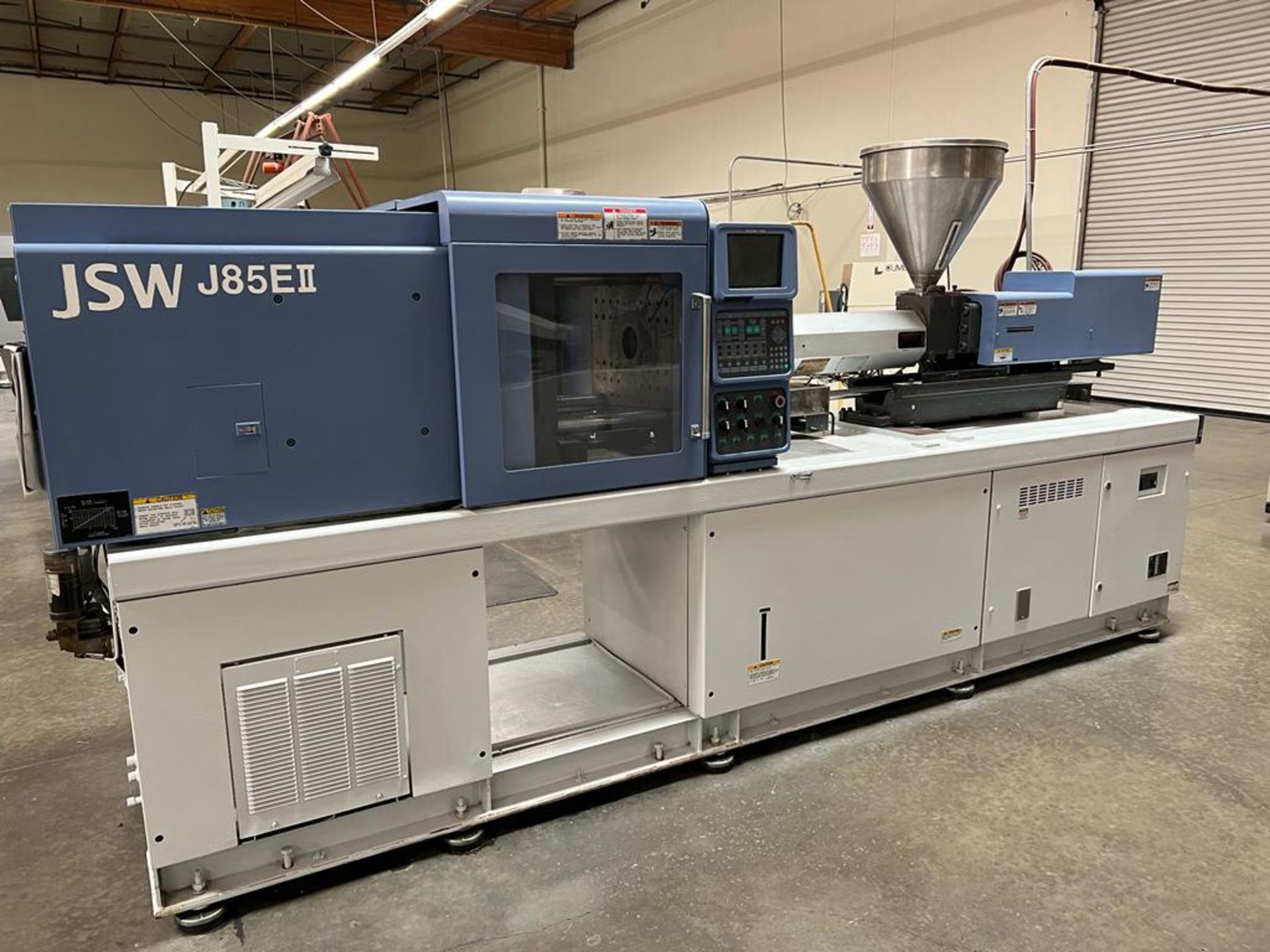 JSW MODEL J85E II, 85 TON PLASTIC INJ MOLDING MACHINE, 11.81’’ STROKE, 7.01 SHOT SIZE, SOLD AS IS