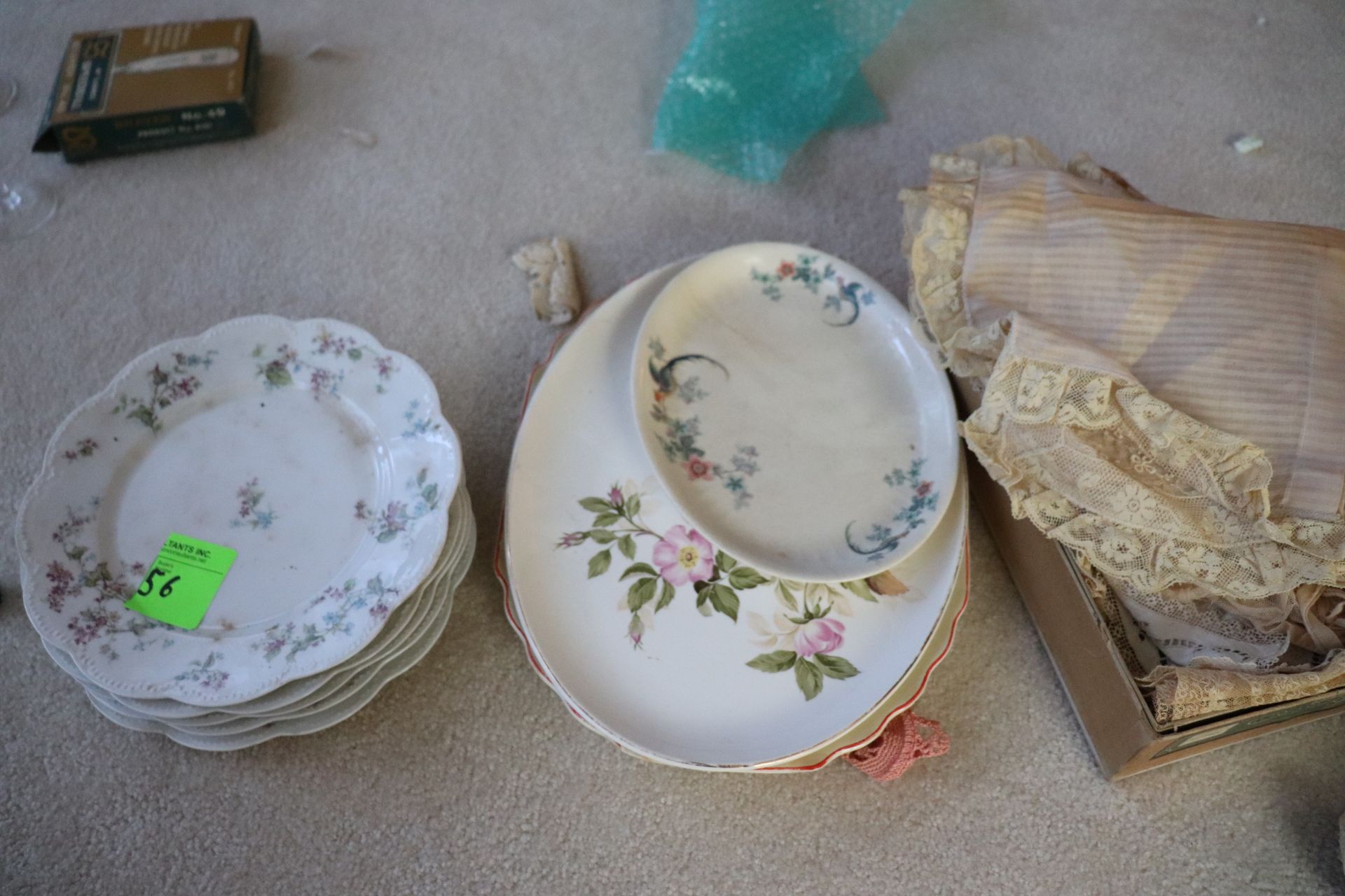 Porcelain plates and platters, and a box of doilies