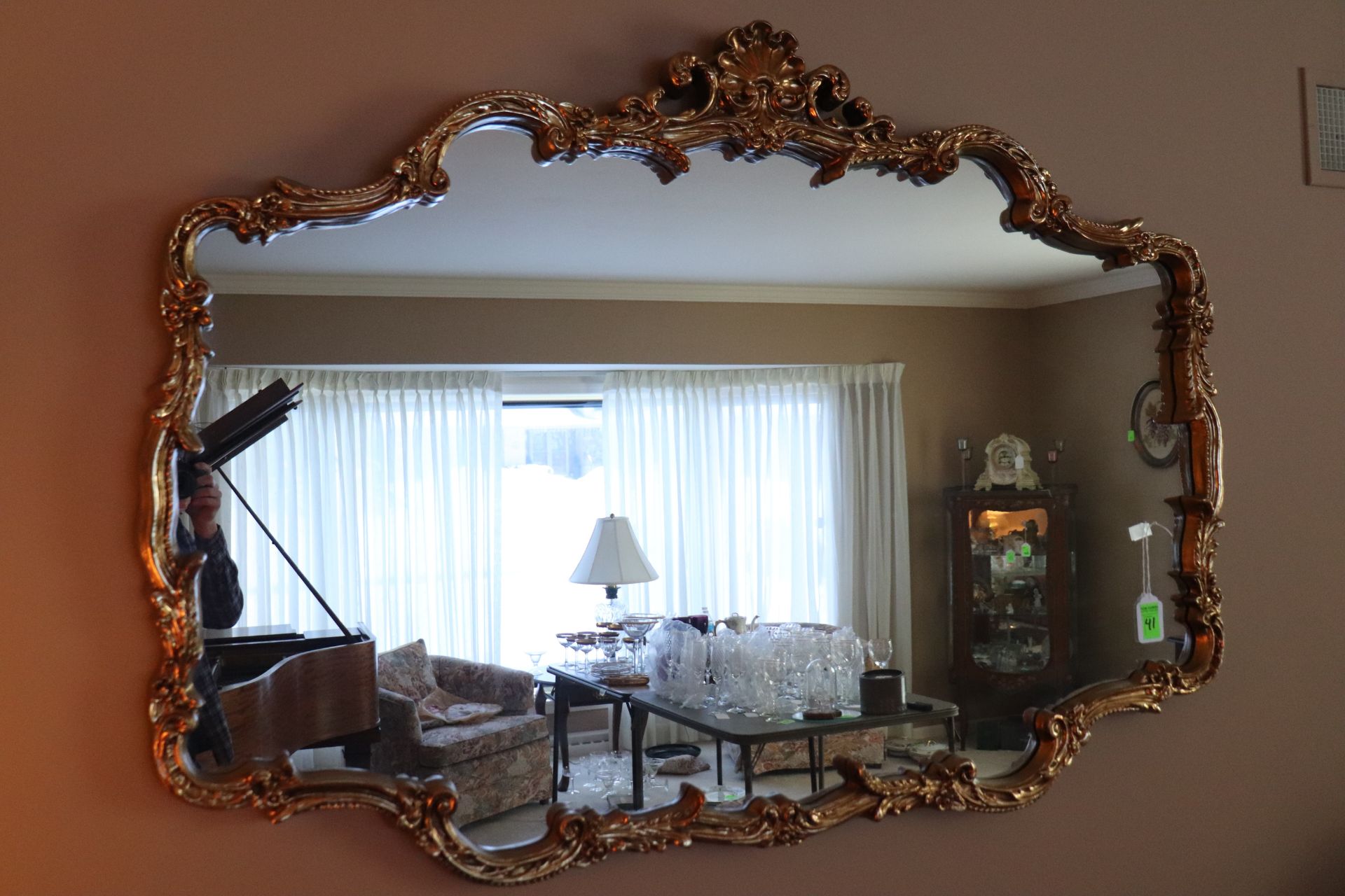 French style gilt composition wall mirror having shell and scrolled leaf decoration, approximate siz