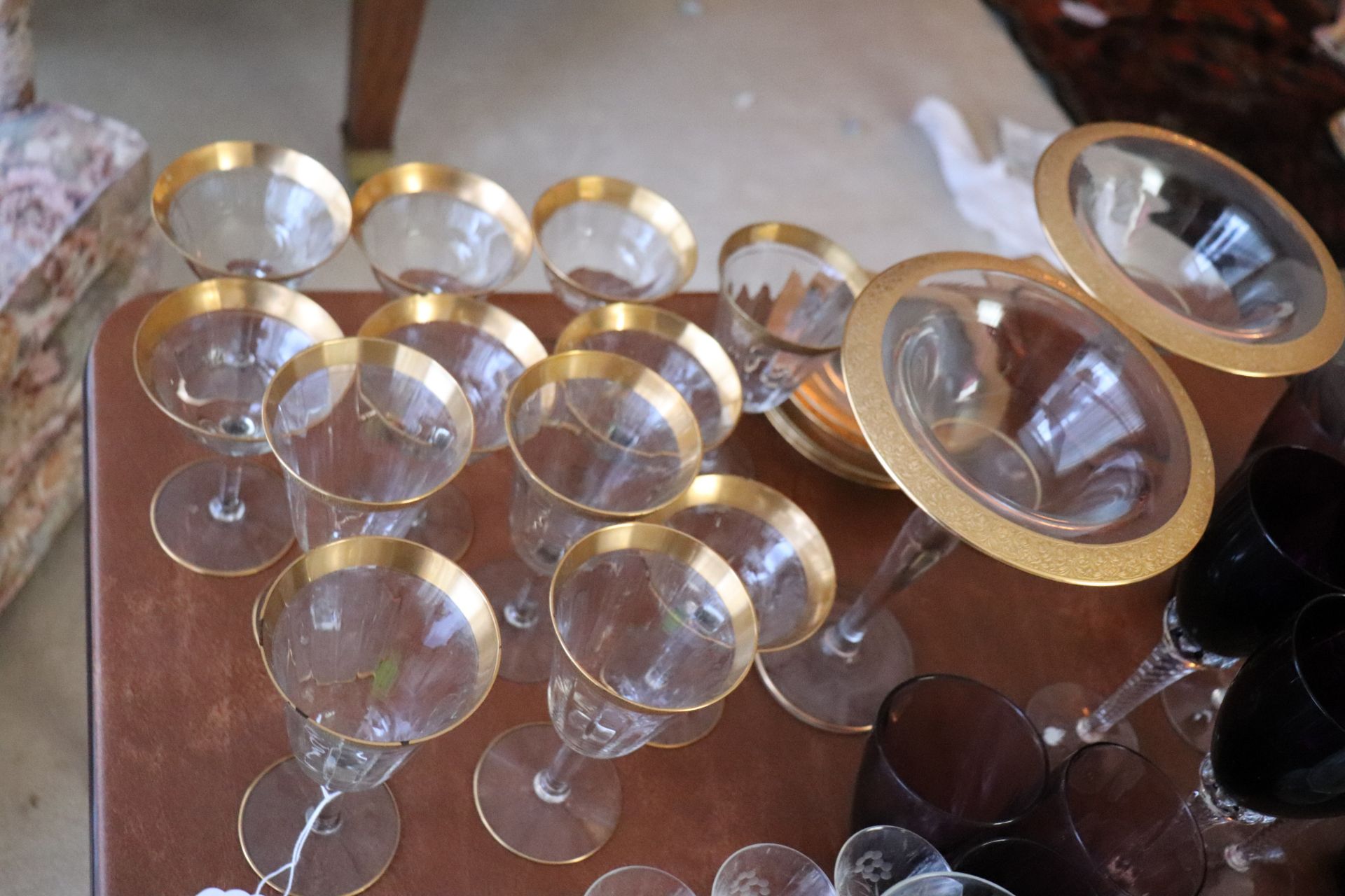 Set of gilded wine cups and saucers
