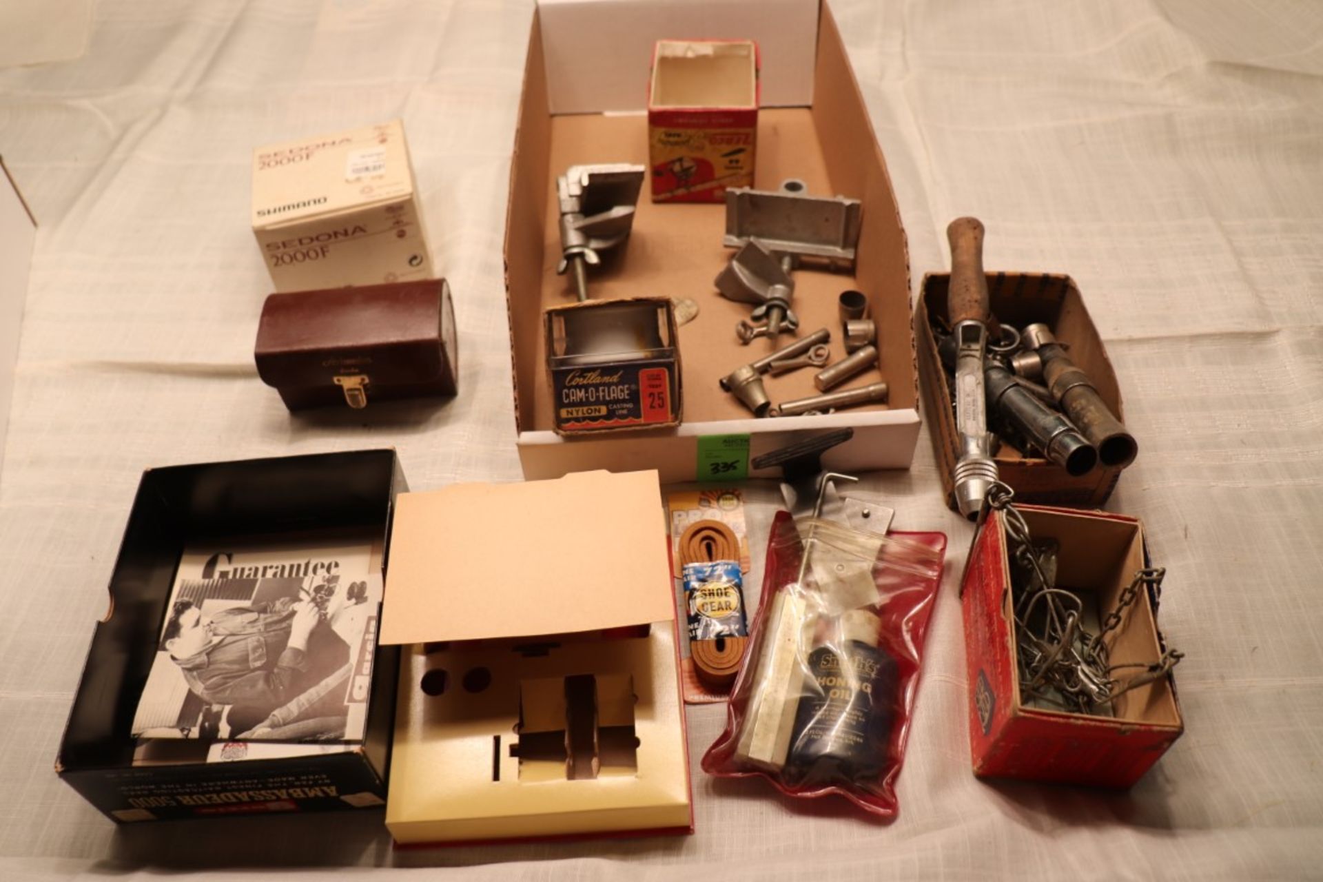 Fishing pole components, empty fishing reel boxes and miscellaneous