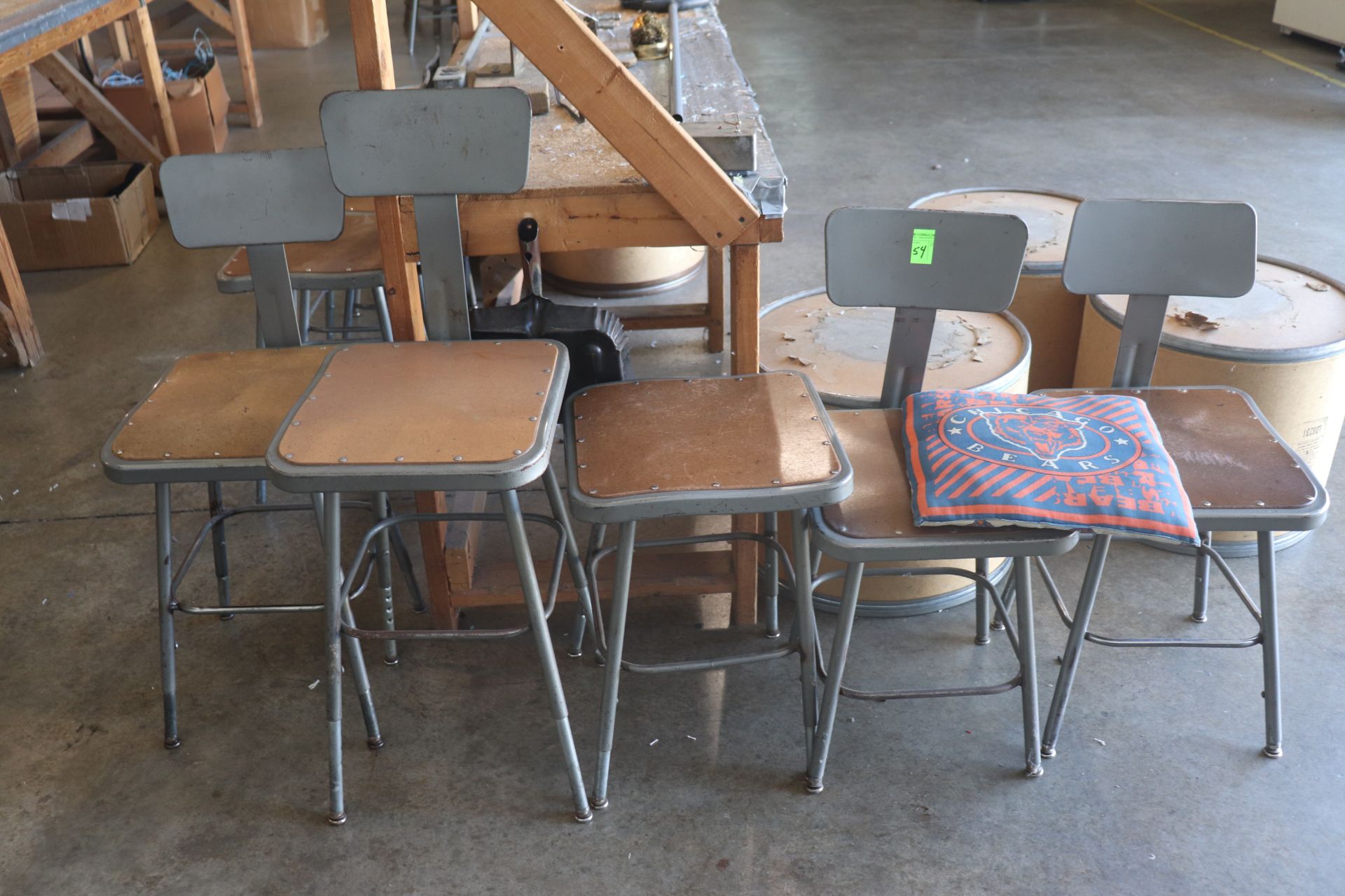 Four metal framed task chairs and one stool