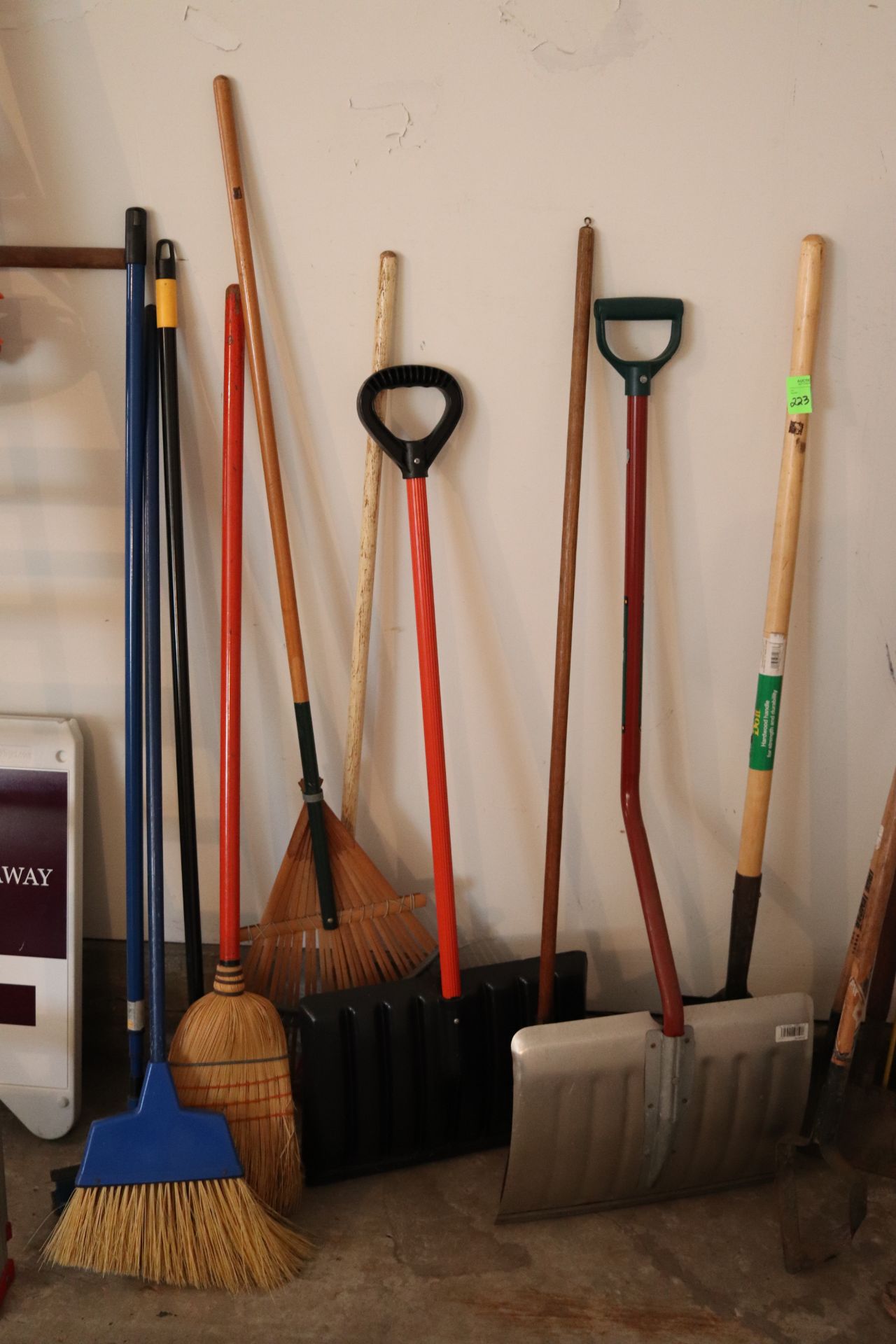 All hand tools pictured including snow shovels, rakes, and spades