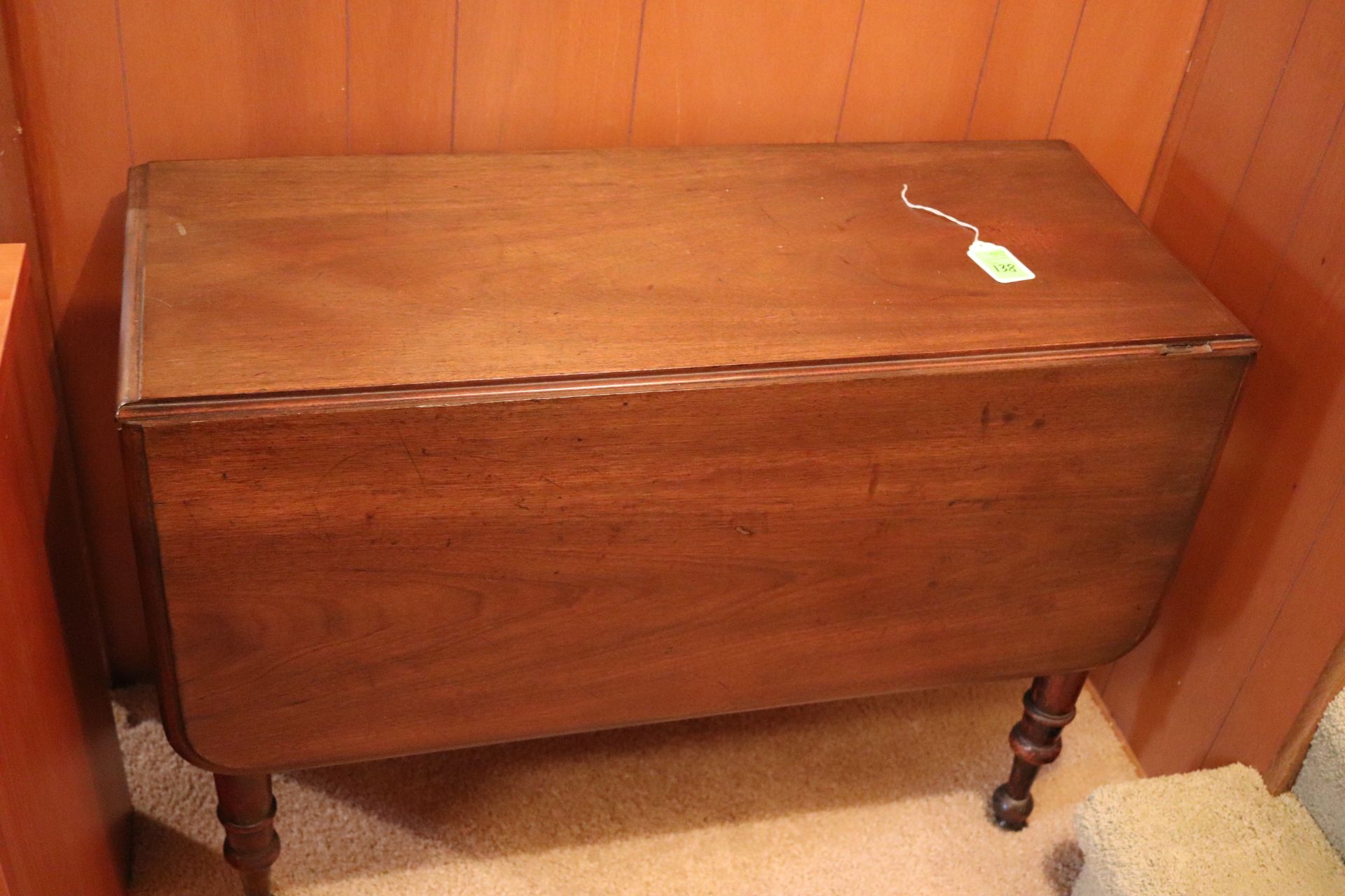 Victorian walnut drop leaf table, rectangular top fitted with two drop leaves raised on four legs, a