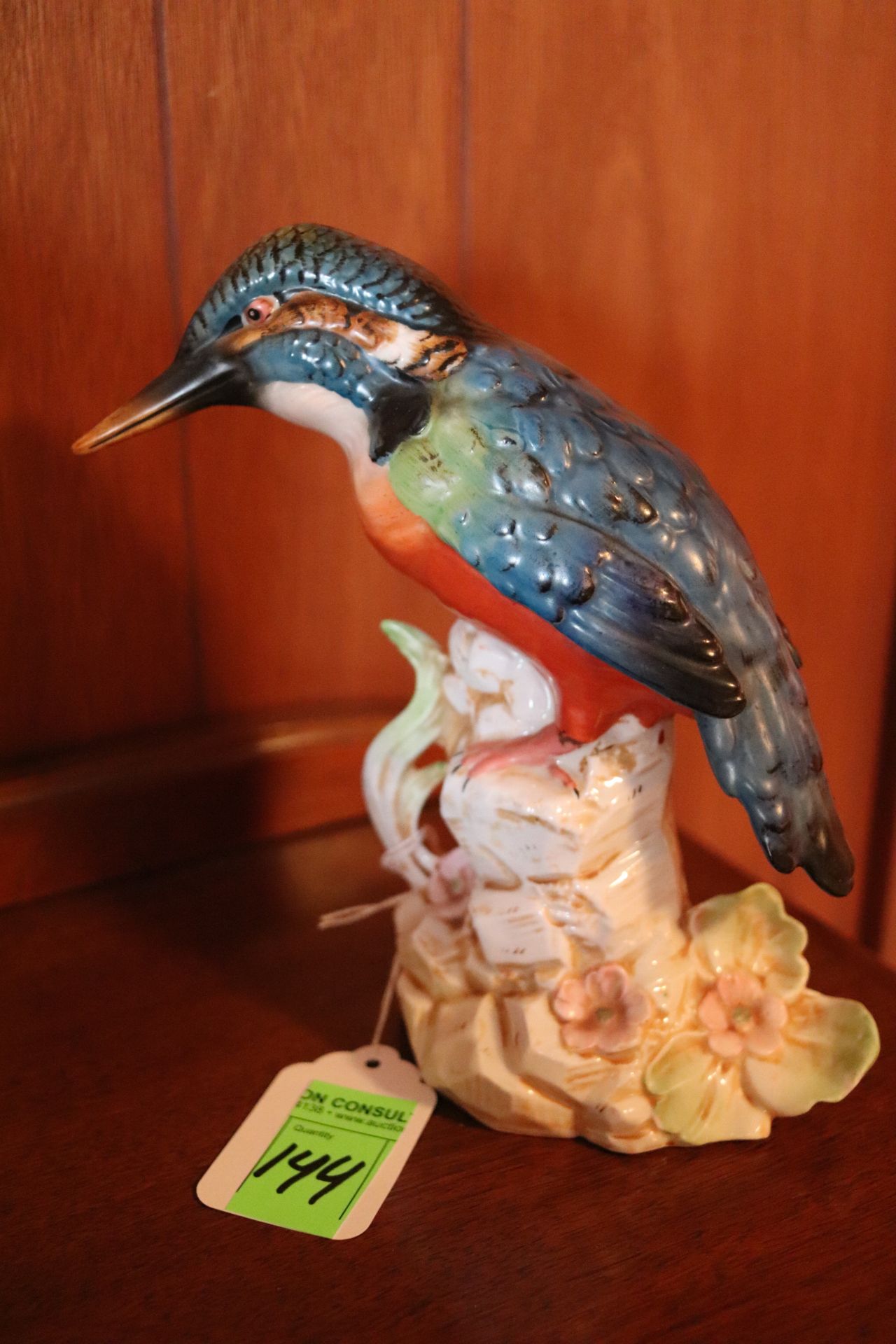 Porcelain figurine depicting hummingbird in floral scene, height 8-1/2"