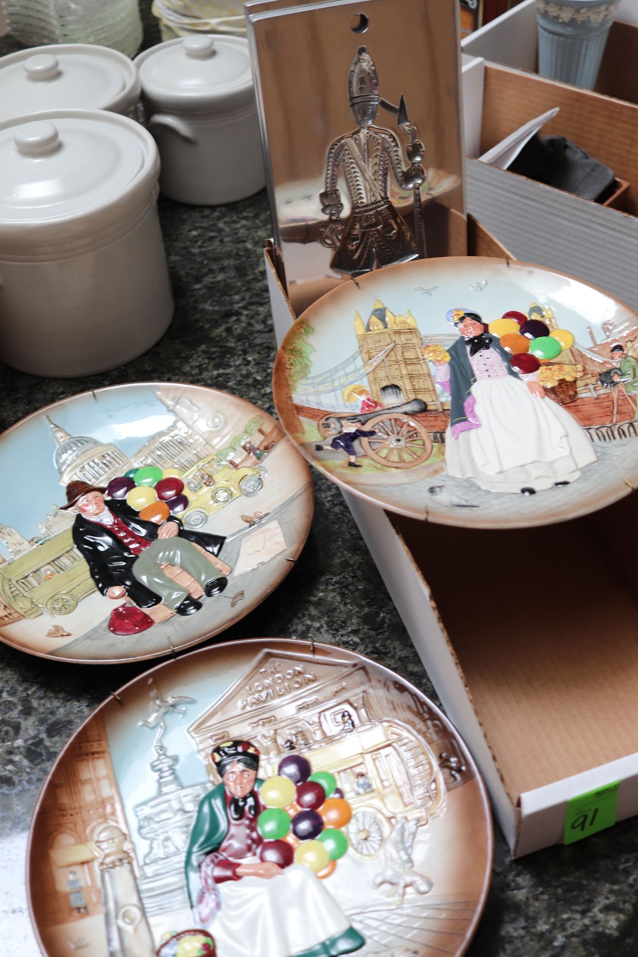 Three decorative plates by Royal Doulton, "Balloon Man", "Biddy Penny Farthing" and "The Old Balloon