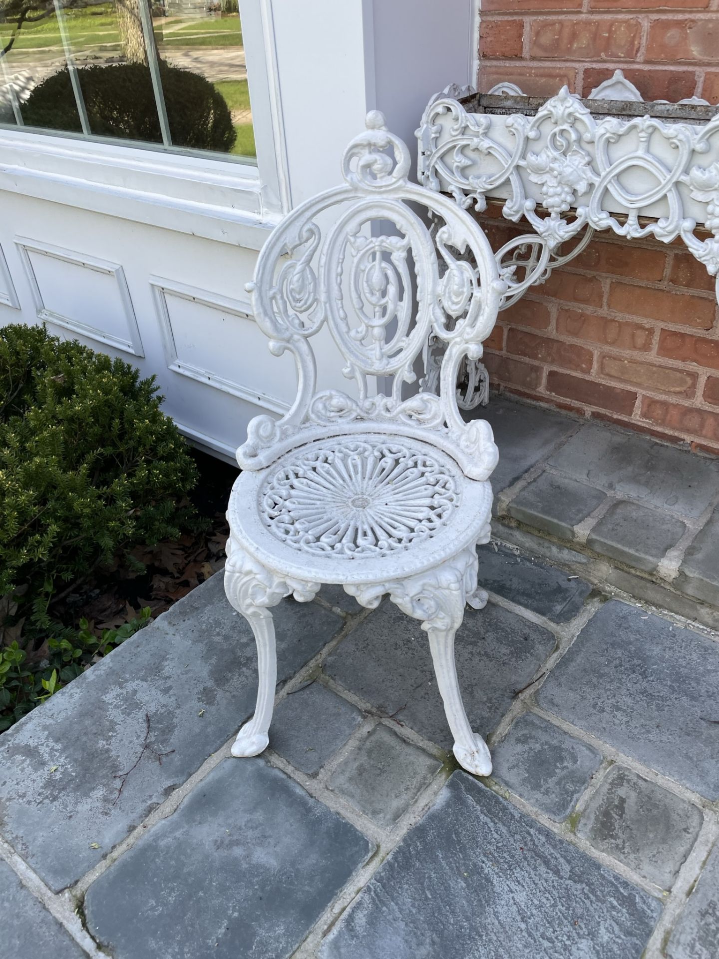 Pair of Victorian style painted white wrought iron chairs