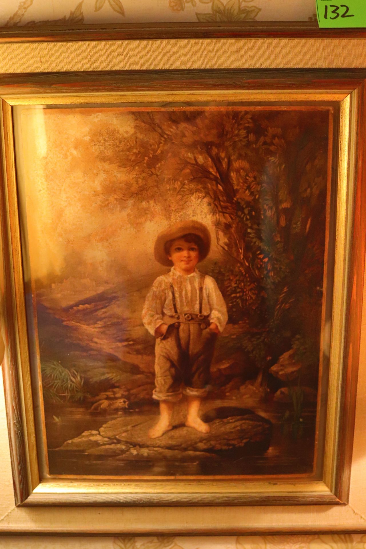 Color print on paper, Victorian child in wooded landscape, in a painted wood frame, 13-1/2" x 10-1/2