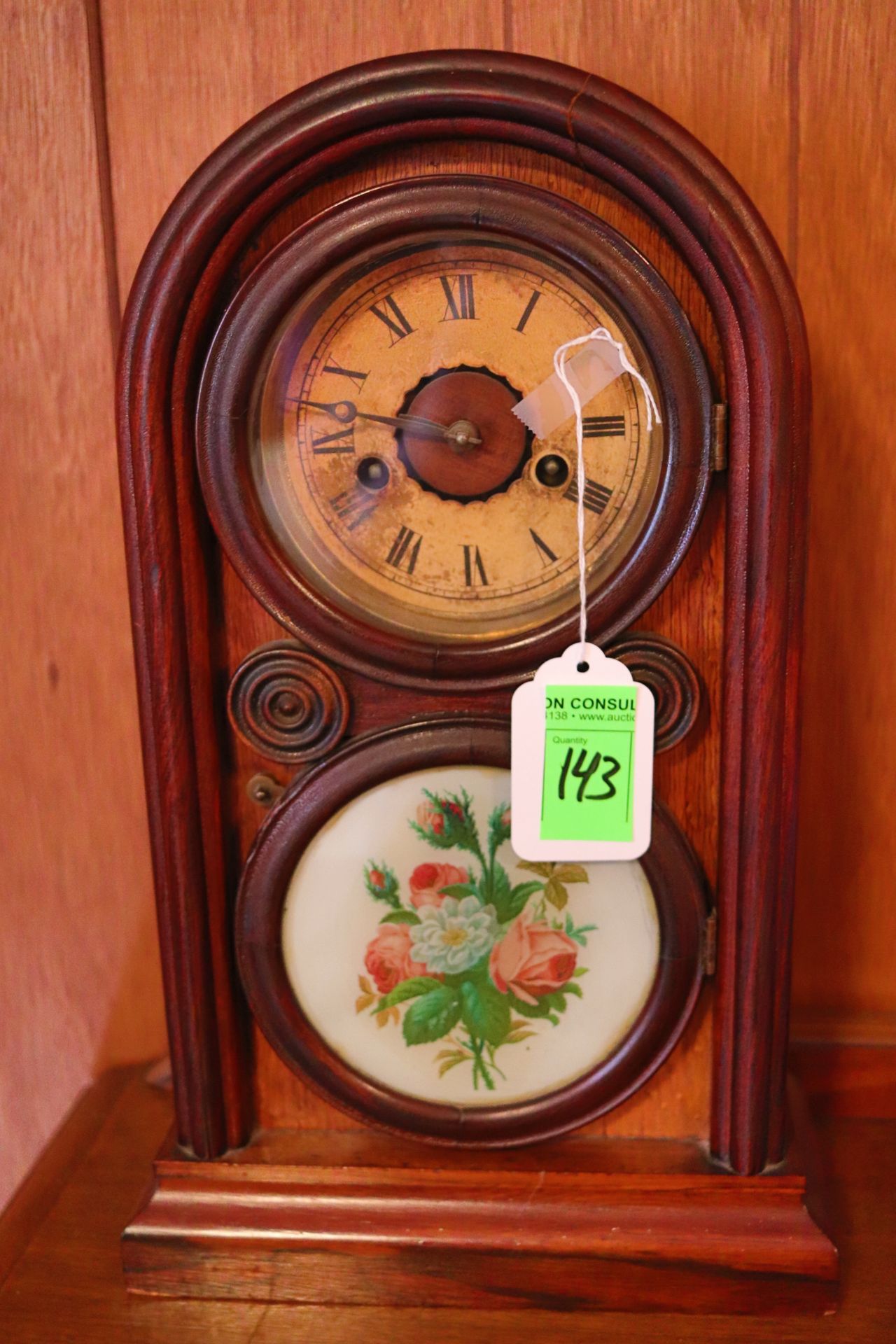 Victorian mantle clock having key wound movement with Roman numeral markers, contained in a walnut c