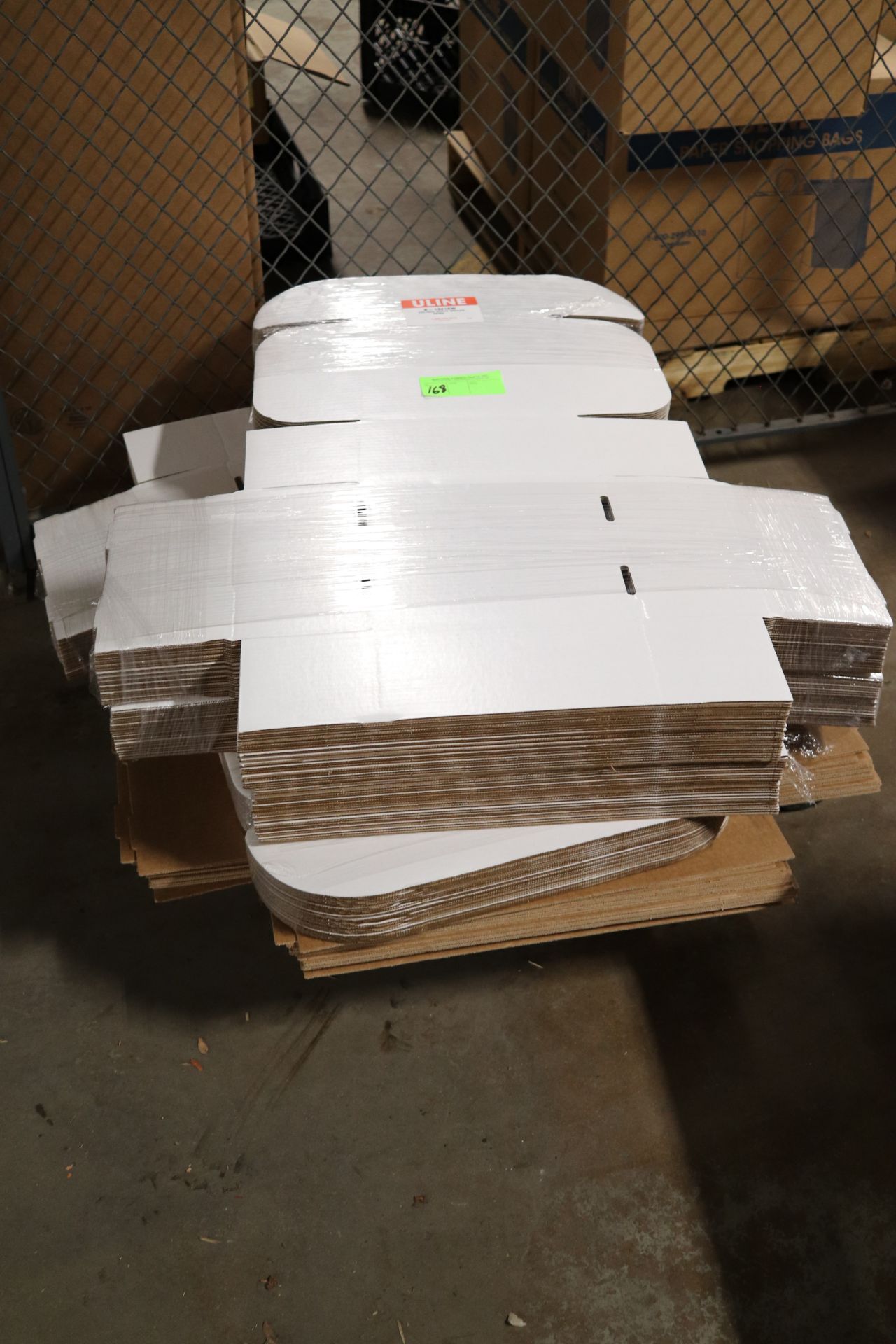 Partial skid of Uline S-13216W 10" x 10" x 5" white mailers, quantity 60