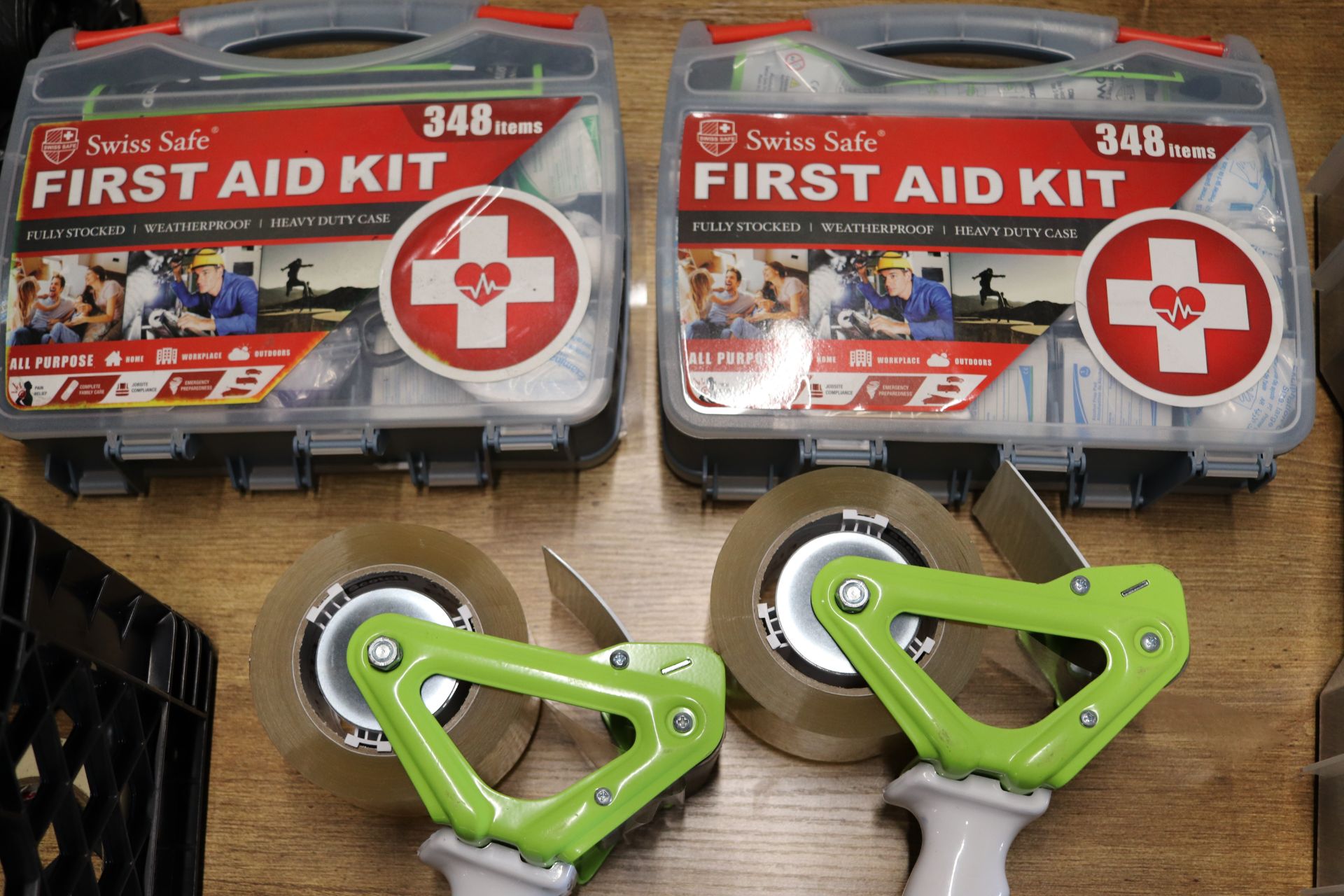 Two Uline tape dispensers and two first aid kits