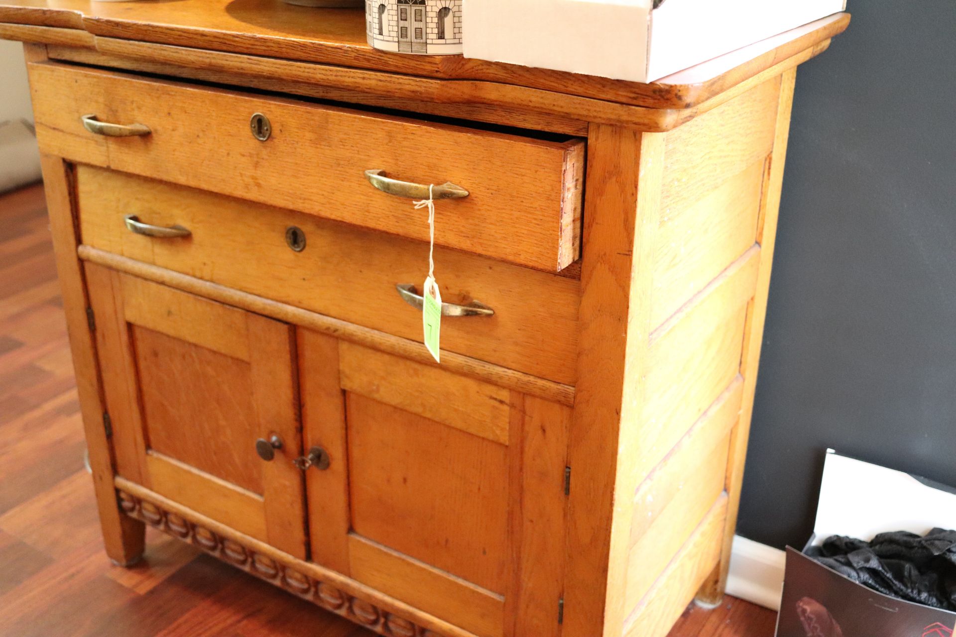 Victorian oak washstand, rectangular top over two drawers over two doors with brass pulls, approxima