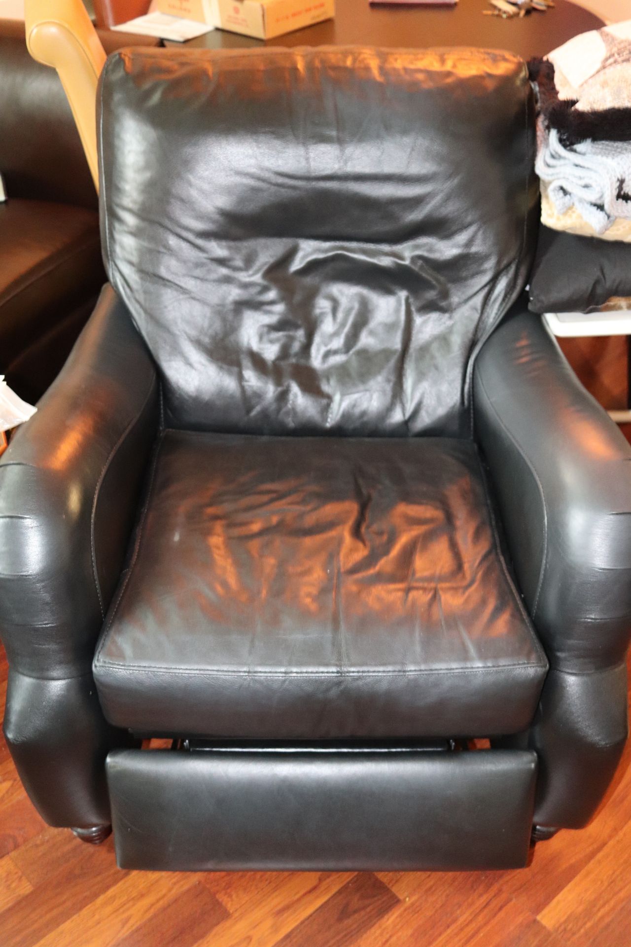 Black leather upholstered reclining armchair, approximate height 36"