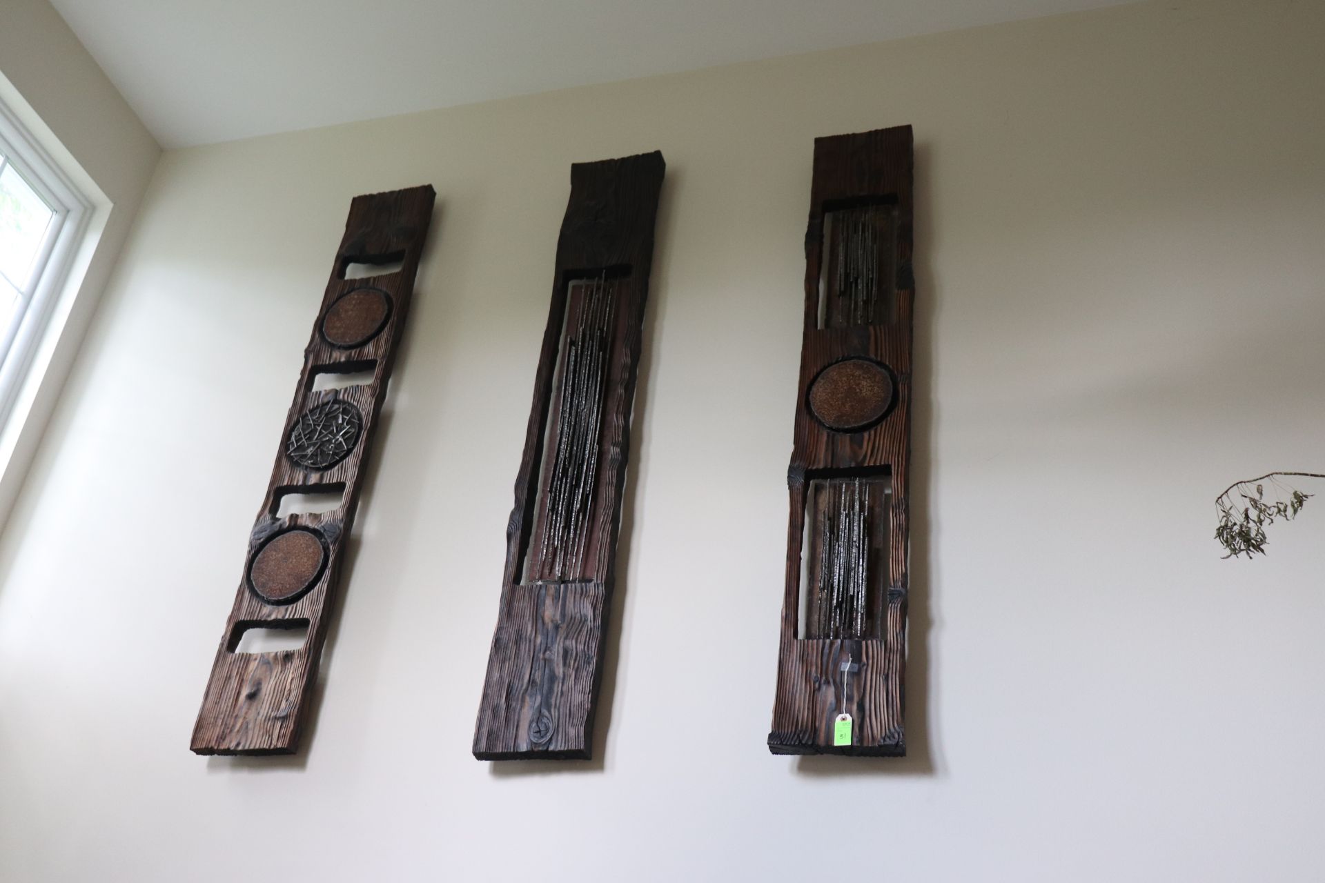 Three carved wood panel sculptures each having metal rod decoration, approximate height 67", width 1