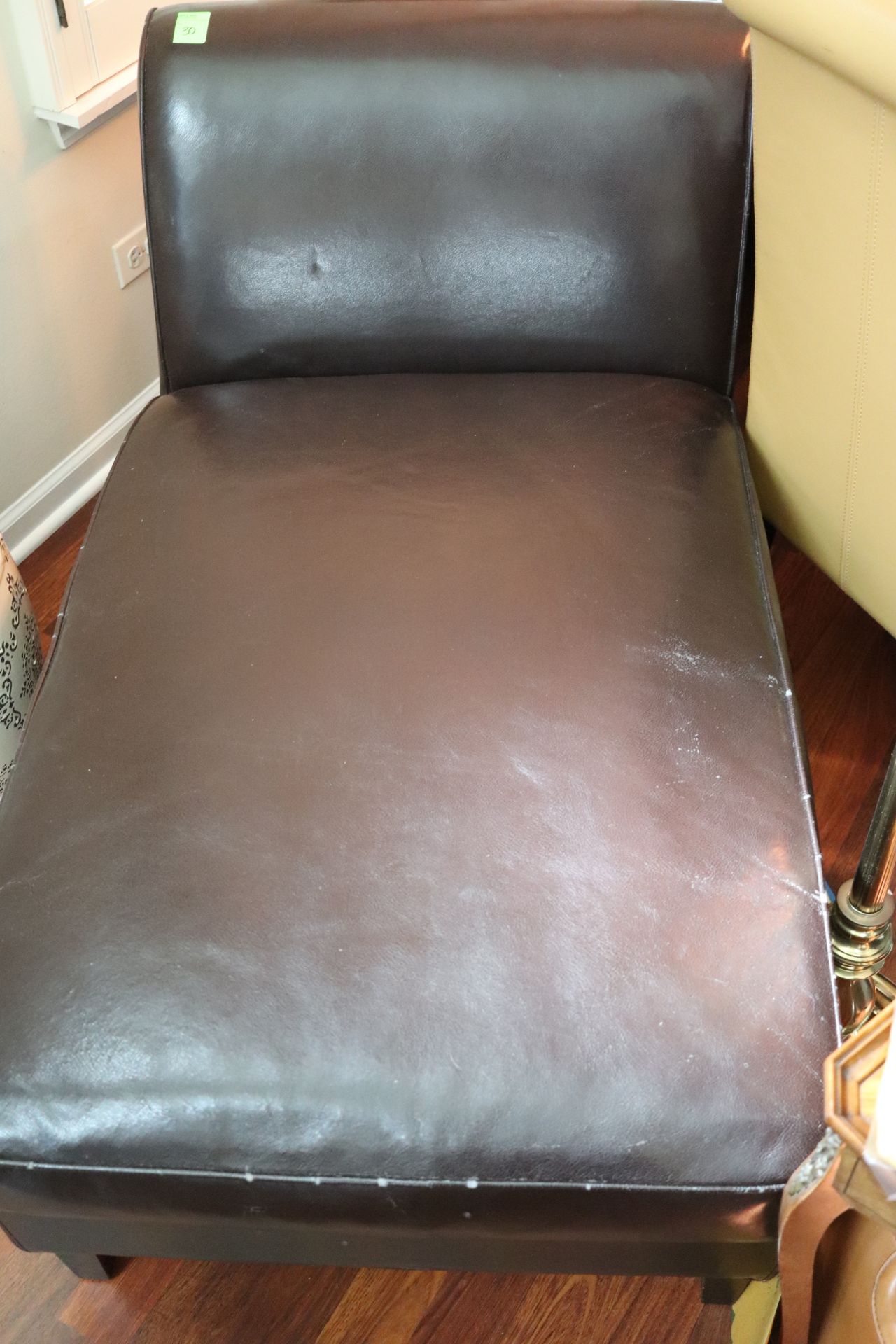 Black leather upholstered chaise lounge, approximate height 30", length 48"