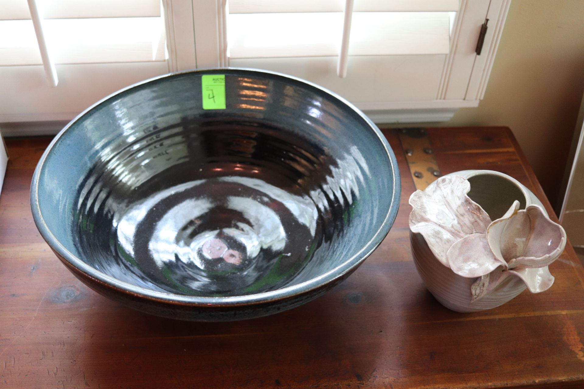 Two pottery pieces: one large bowl and vase