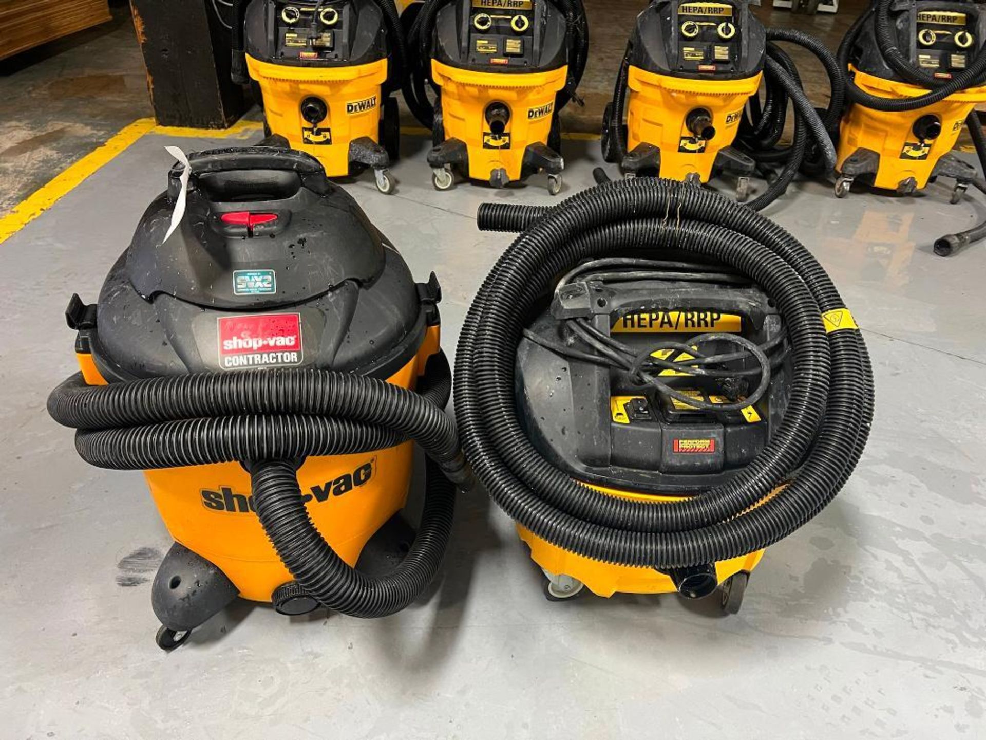 (1) Shopvac Contractor Vacuum & (1) DeWalt DWV012 10 Gallon Dust Extractor Vacuum, HEPA/RRP. Located