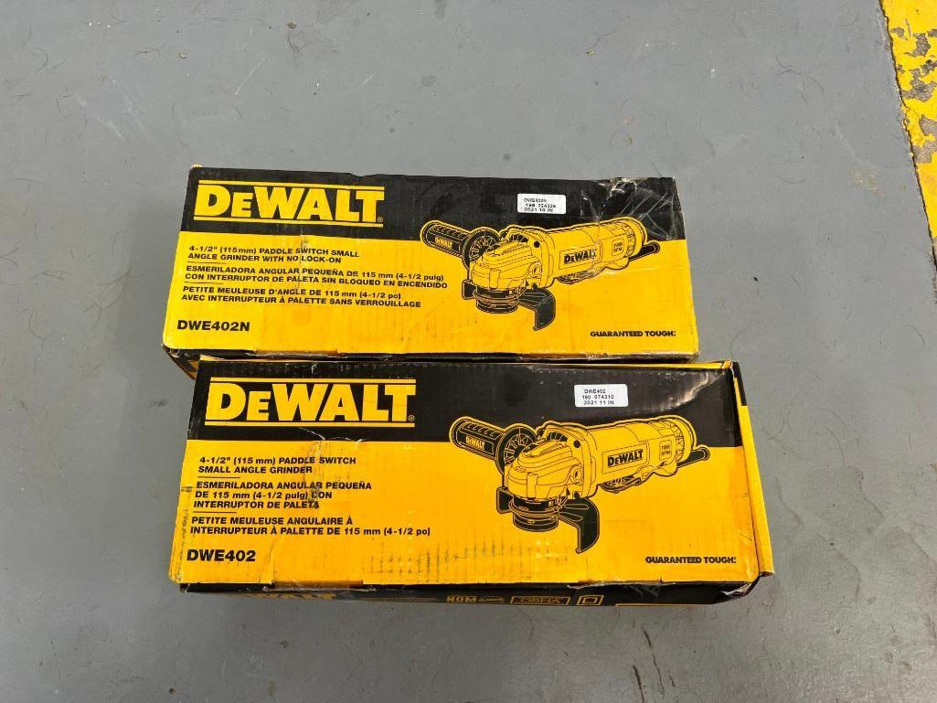 (2) New Dewalt 4 1/2" Paddle Switch Small Angle Grinder. DWE402. Located in Mt. Pleasant, IA