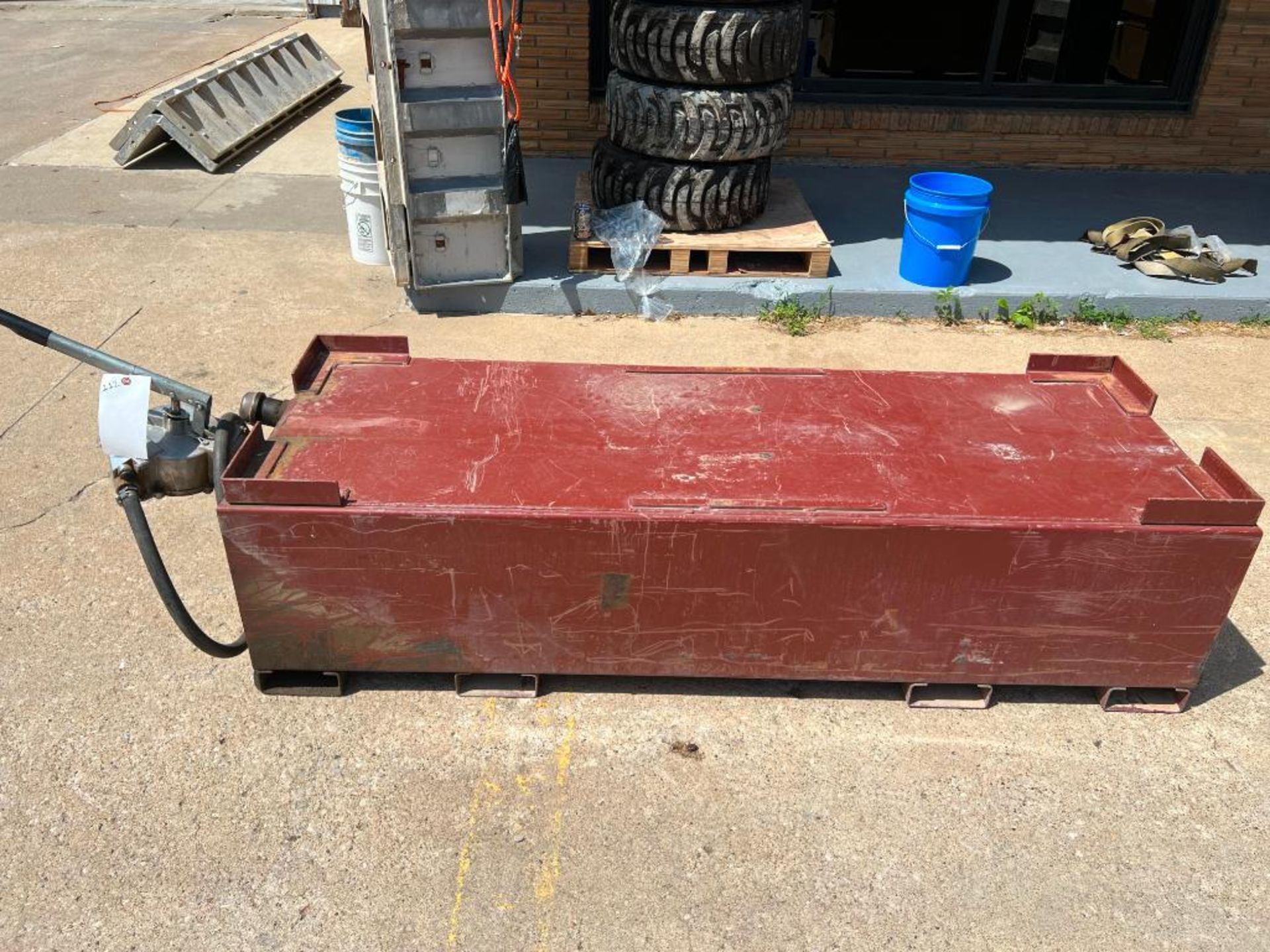 Fuel Tank with Hand Operated Pump. Located in Mt. Pleasant, IA