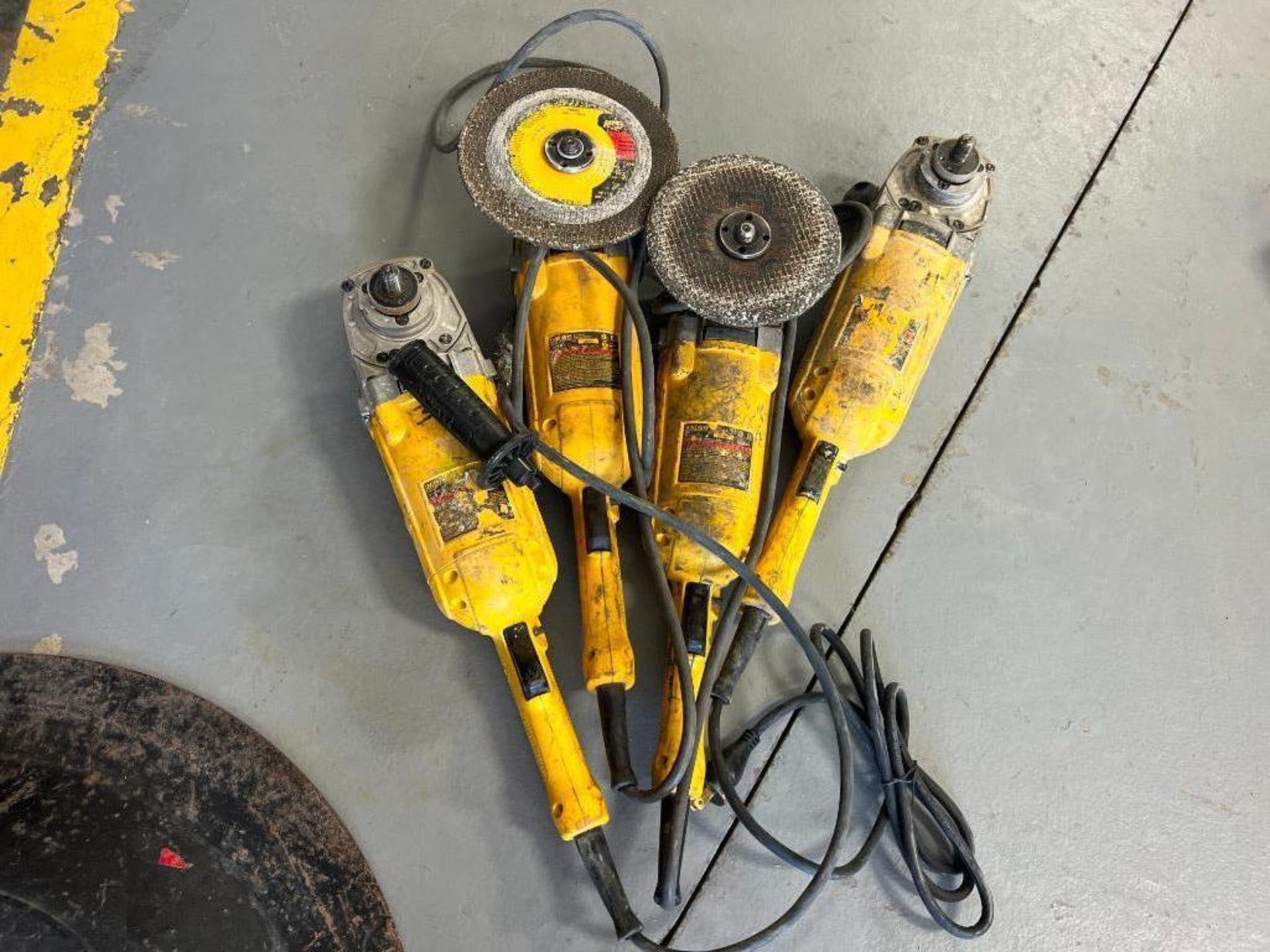 (4) DeWalt DWE4519 - 9" Angle Grinders, 120 V. Located in Mt. Pleasant, IA