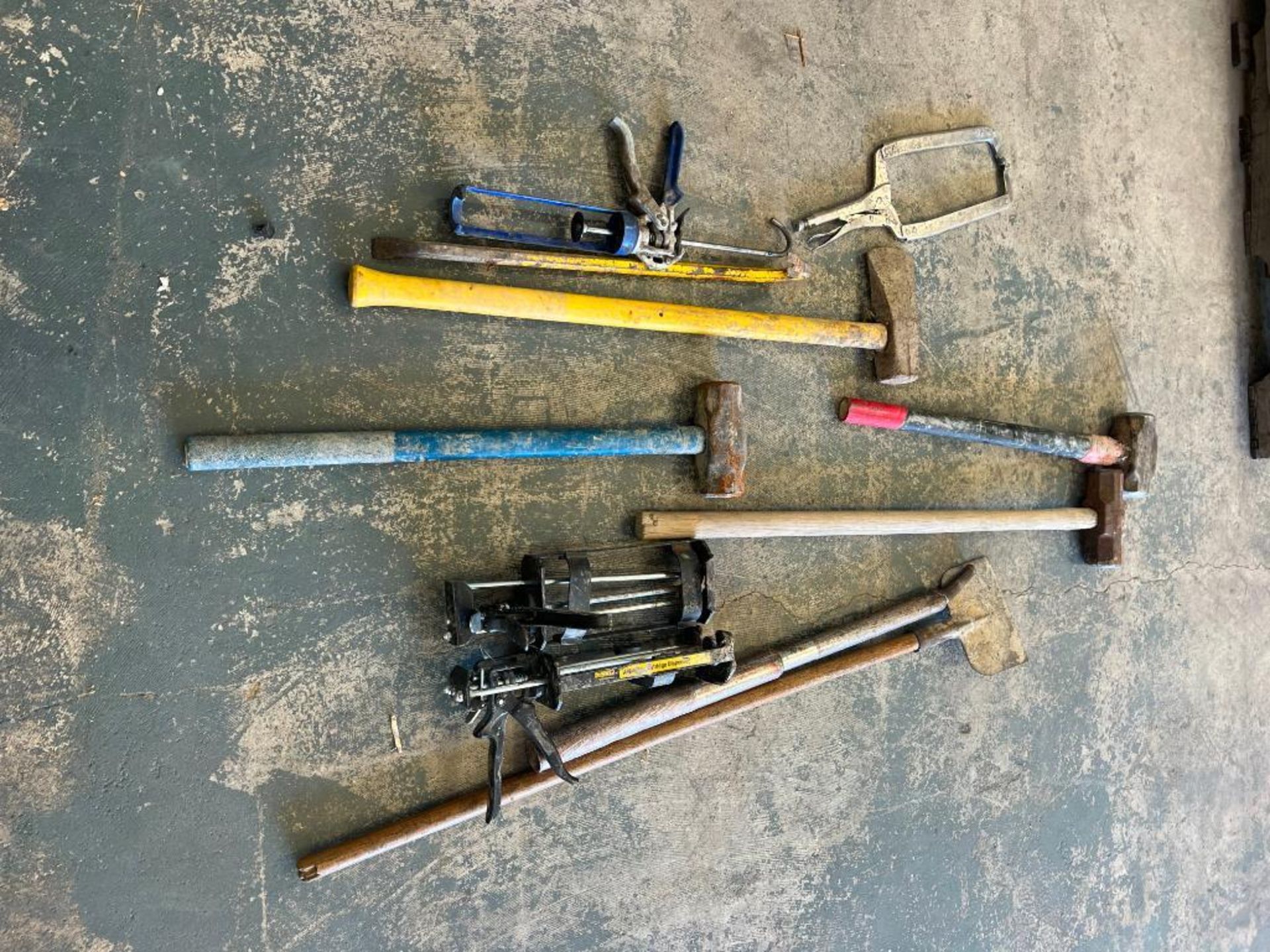 (4) Sledge Hammers & Apoxy Guns. Located in Mt. Pleasant, IA