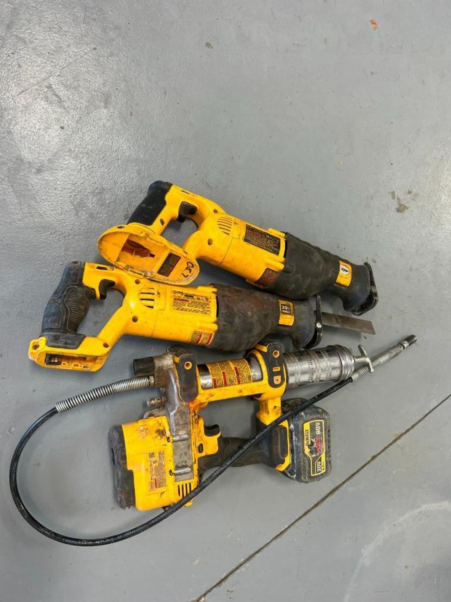 (1) DeWalt Cordless Grease Gun & (2) DeWalt Sawzall, no battery. Located in Mt. Pleasant, IA