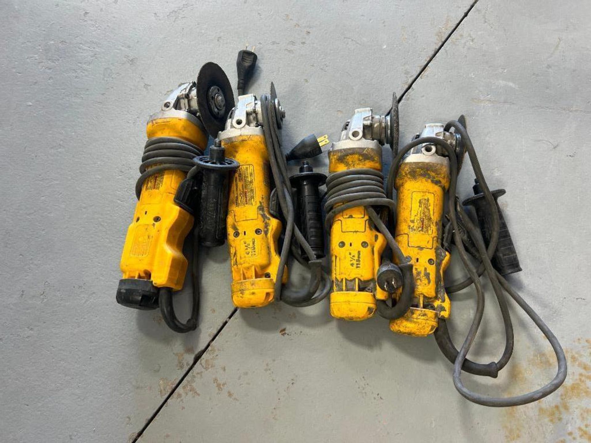 (4) DeWalt DWE402N, 4 1/2" Angle Grinders, 120 V. Located in Mt. Pleasant, IA