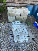Pallet of 12" Concrete Cinder Blocks, Concrete Brick, and assorted empty barrels. Located in Altamon