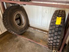 (1) New Uniroyal 11 R 22.5, HD 60, 10 Bolt Rim & (1) Used Tire.  Located in Altamont, IL