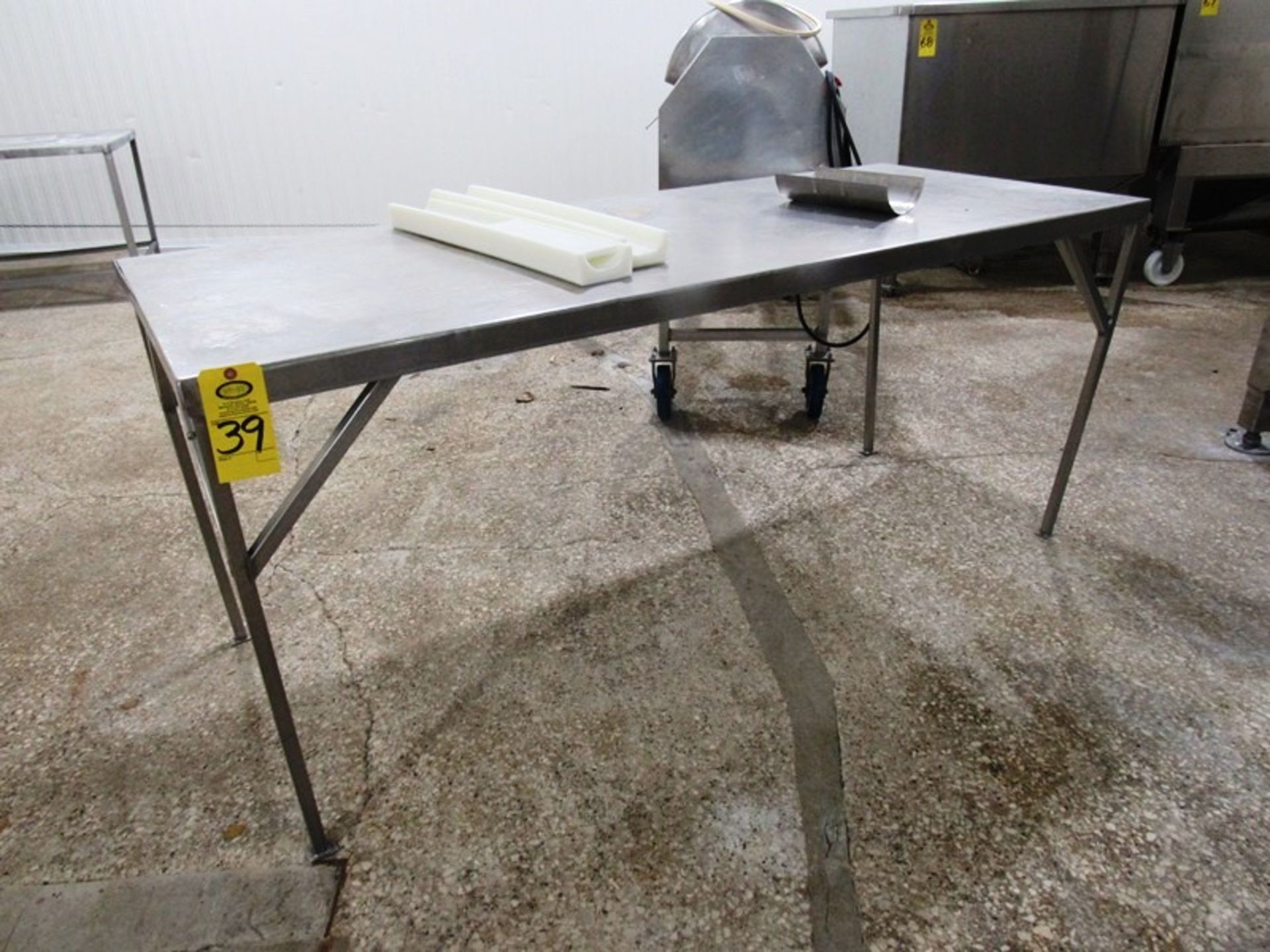 Stainless Steel Table, 34" W X 7' L X 36" T Removal: By Appointment Only. Required Rigging Fee $25.