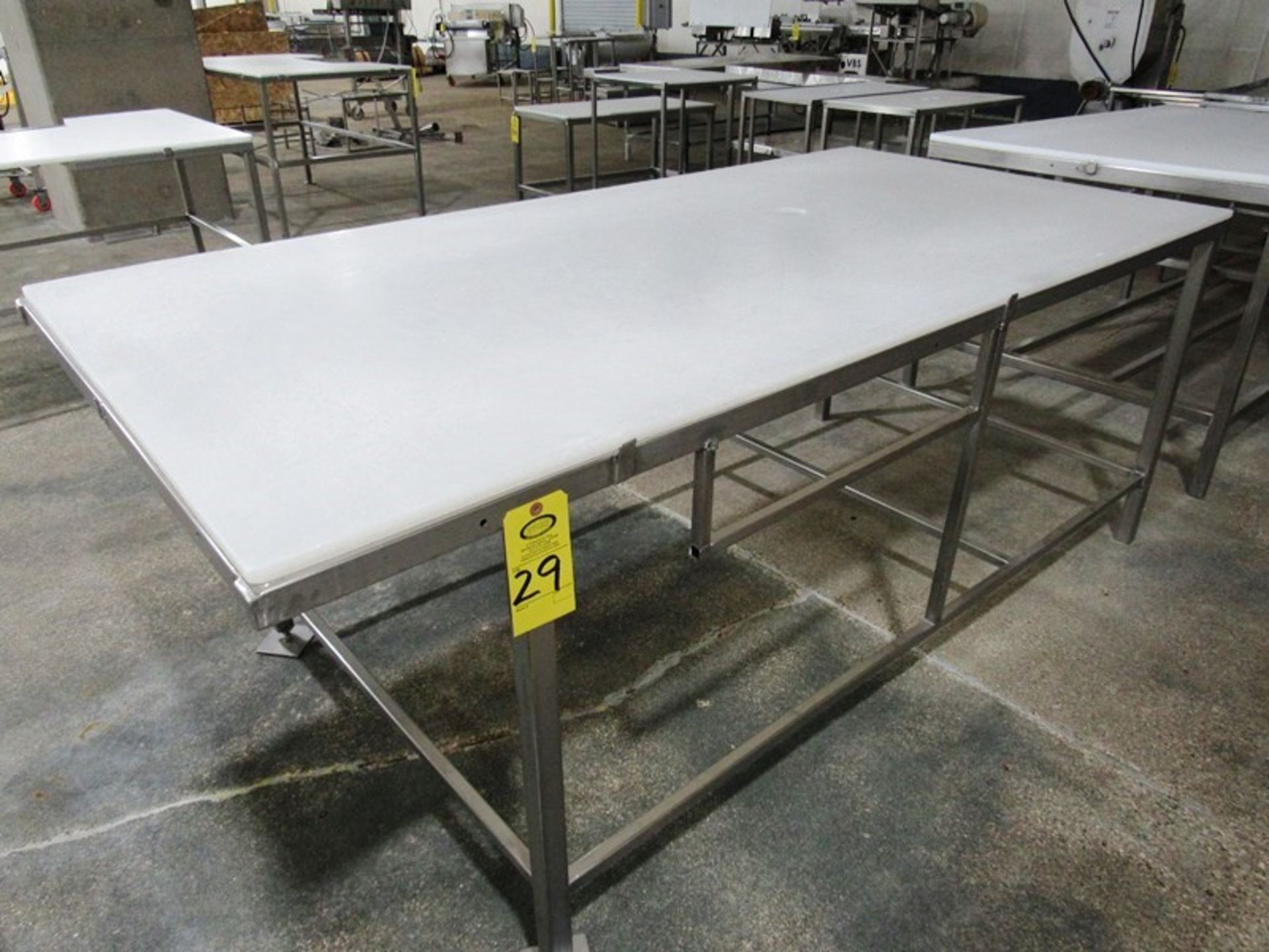 Stainless Steel Table with poly top, 42" W X 86" L Removal: By Appointment Only. Required Rigging