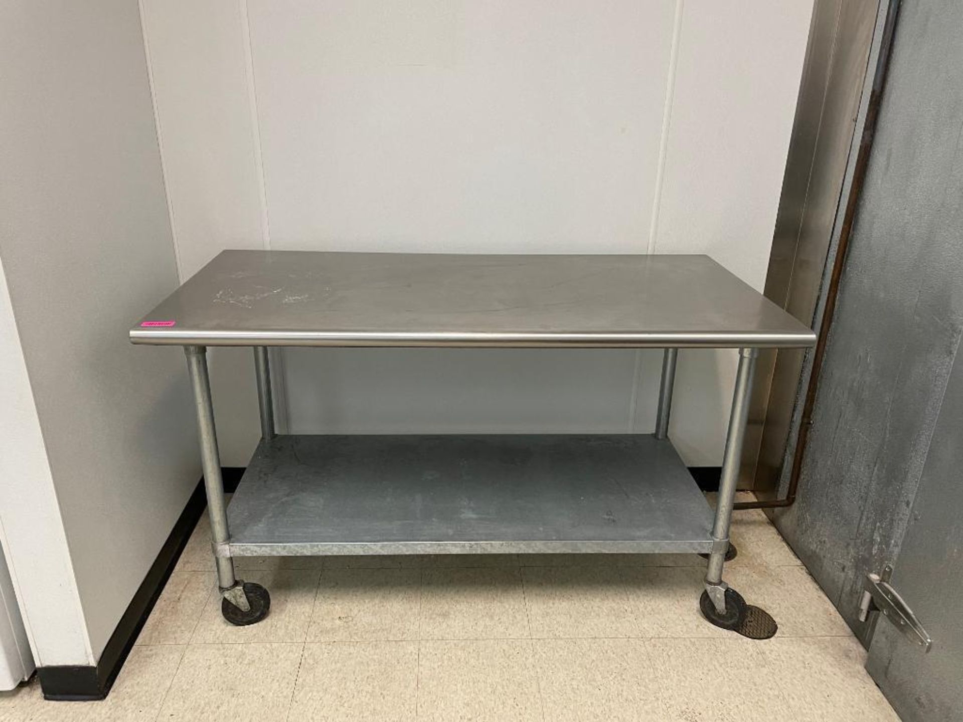DESCRIPTION: 60" X 30" STAINLESS TABLE W/ UNDER SHELF. ADDITIONAL INFORMATION ON CASTERS. SIZE: 60" - Image 2 of 4