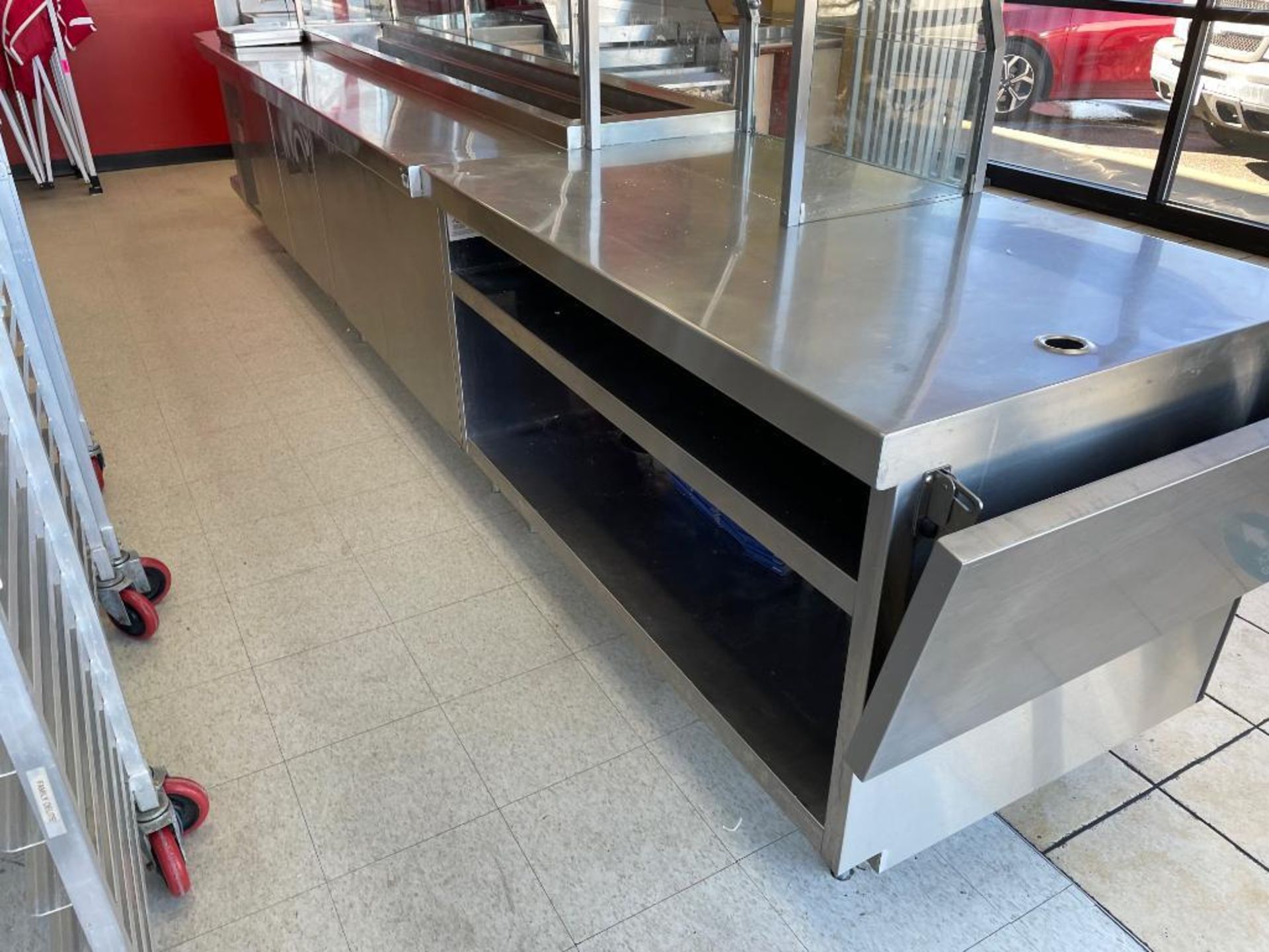 DESCRIPTION: (3) SECTIONS OF STAINLESS SALES COUNTER / CABINETS. W/ ELECTRICAL OUTLETS. ADDITIONAL I - Image 2 of 4