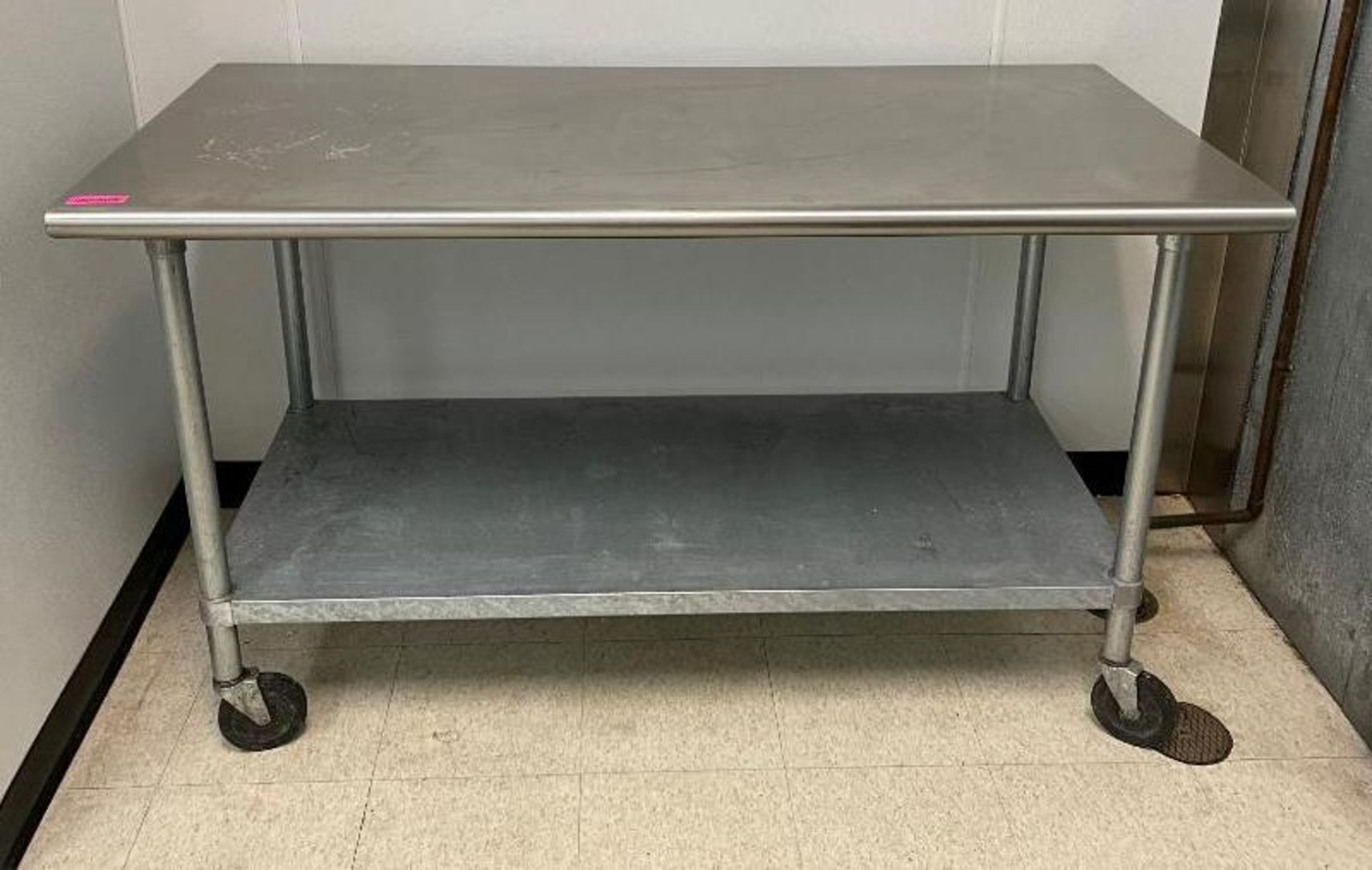 DESCRIPTION: 60" X 30" STAINLESS TABLE W/ UNDER SHELF. ADDITIONAL INFORMATION ON CASTERS. SIZE: 60"