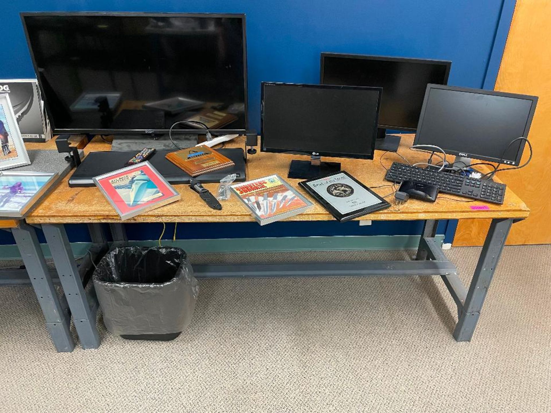 DESCRIPTION: 60" X 30" WORK STATION TABLE W/ CONTENTS. (3) MONITORS, (1) TV, AND SEVERAL KNIVES. LOC